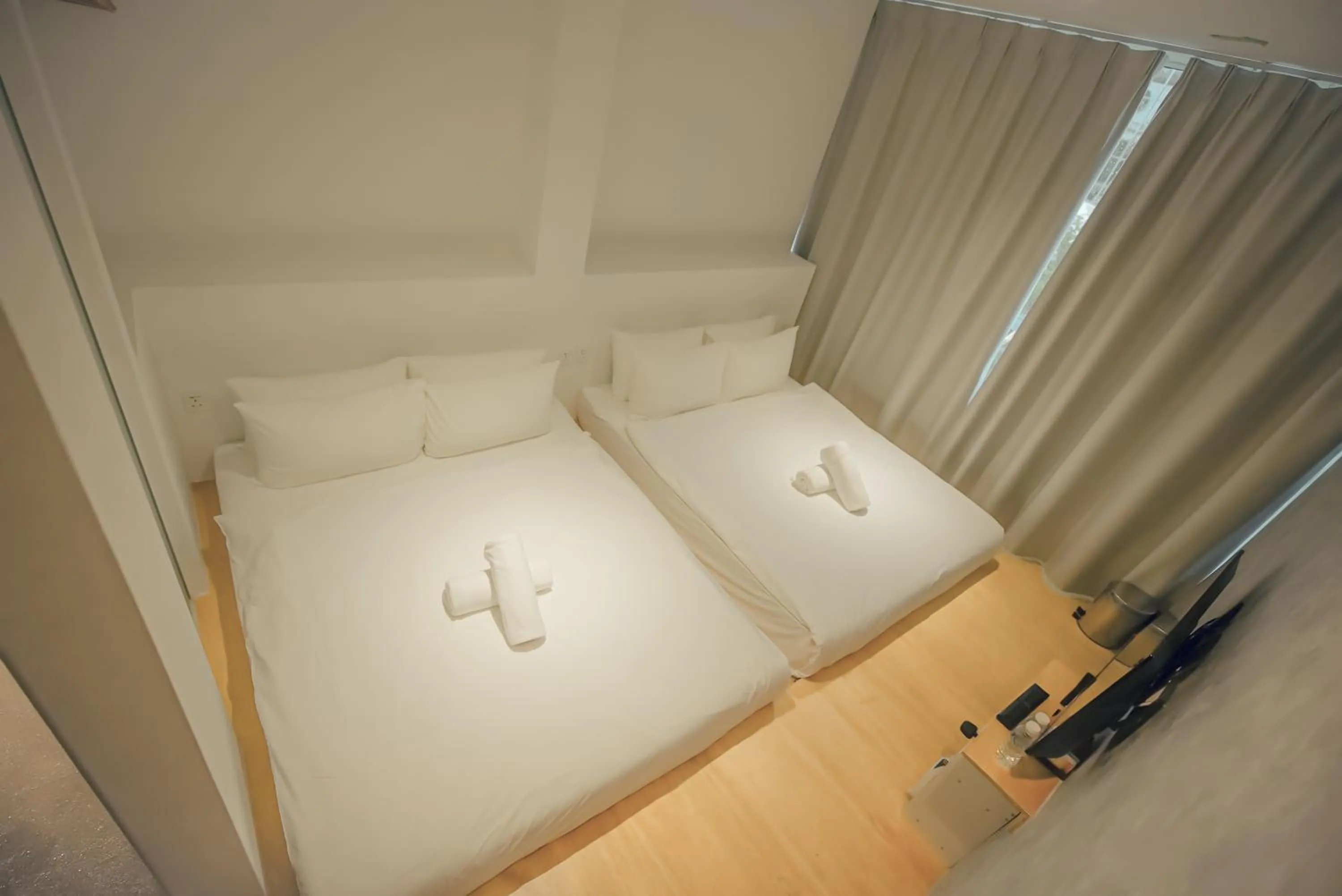 Bed in Double H Boutique Hotel