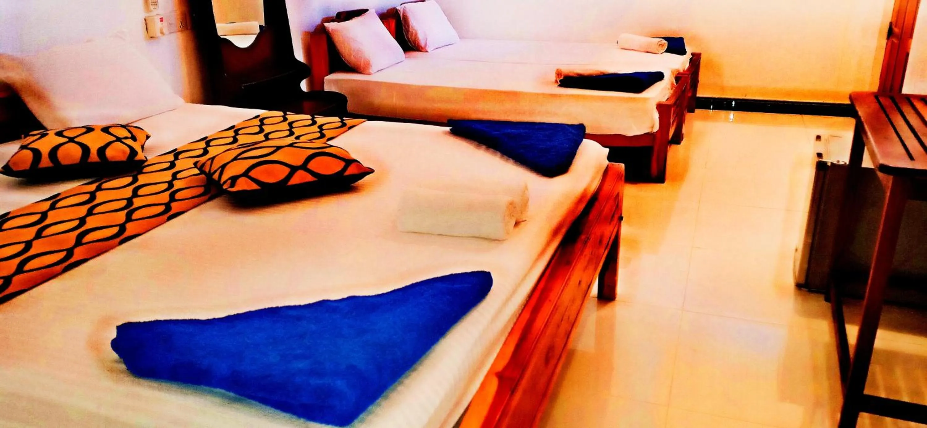 Bed in SURF & SAND Hotel Arugambay