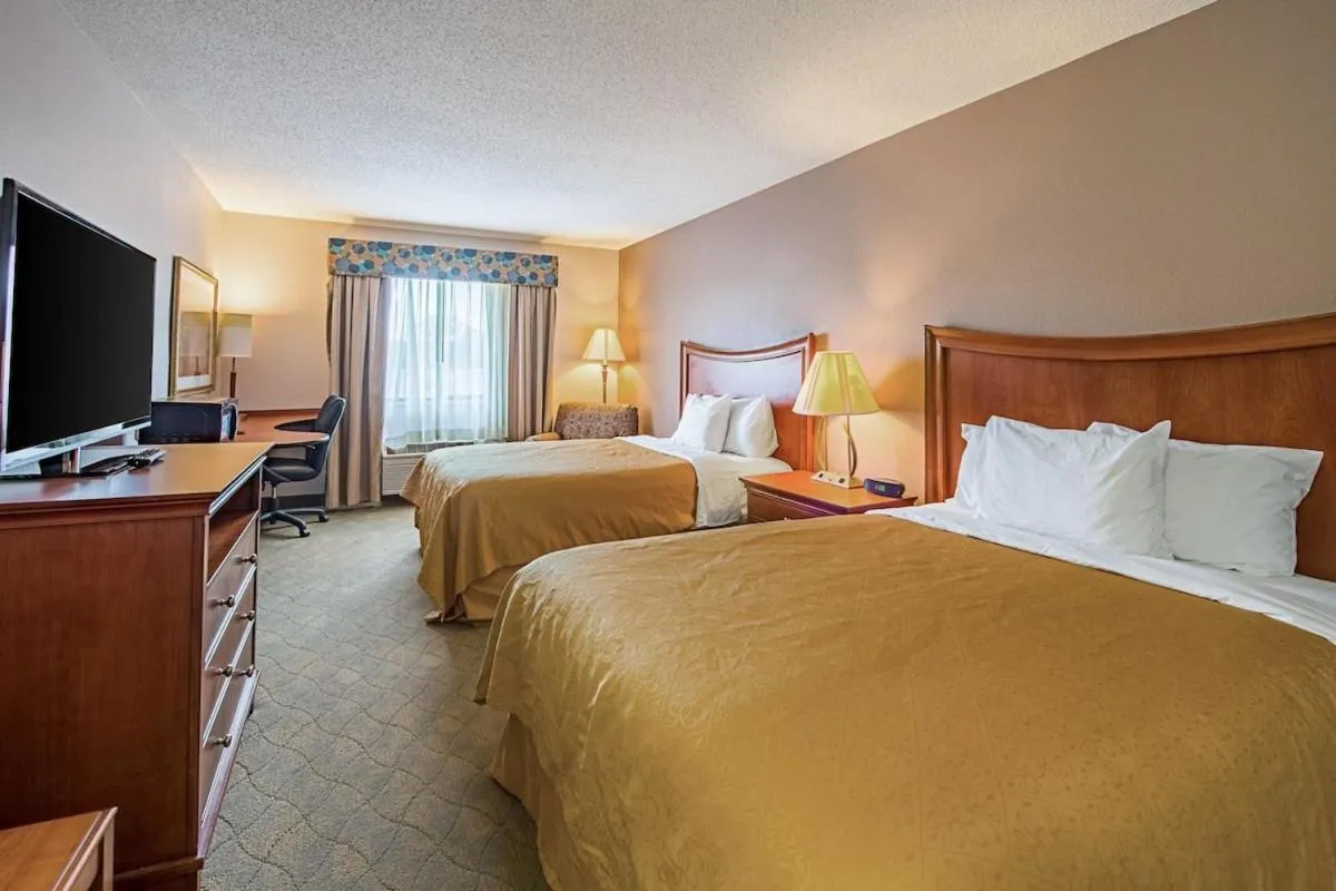 Bed in Royal Inn Suites