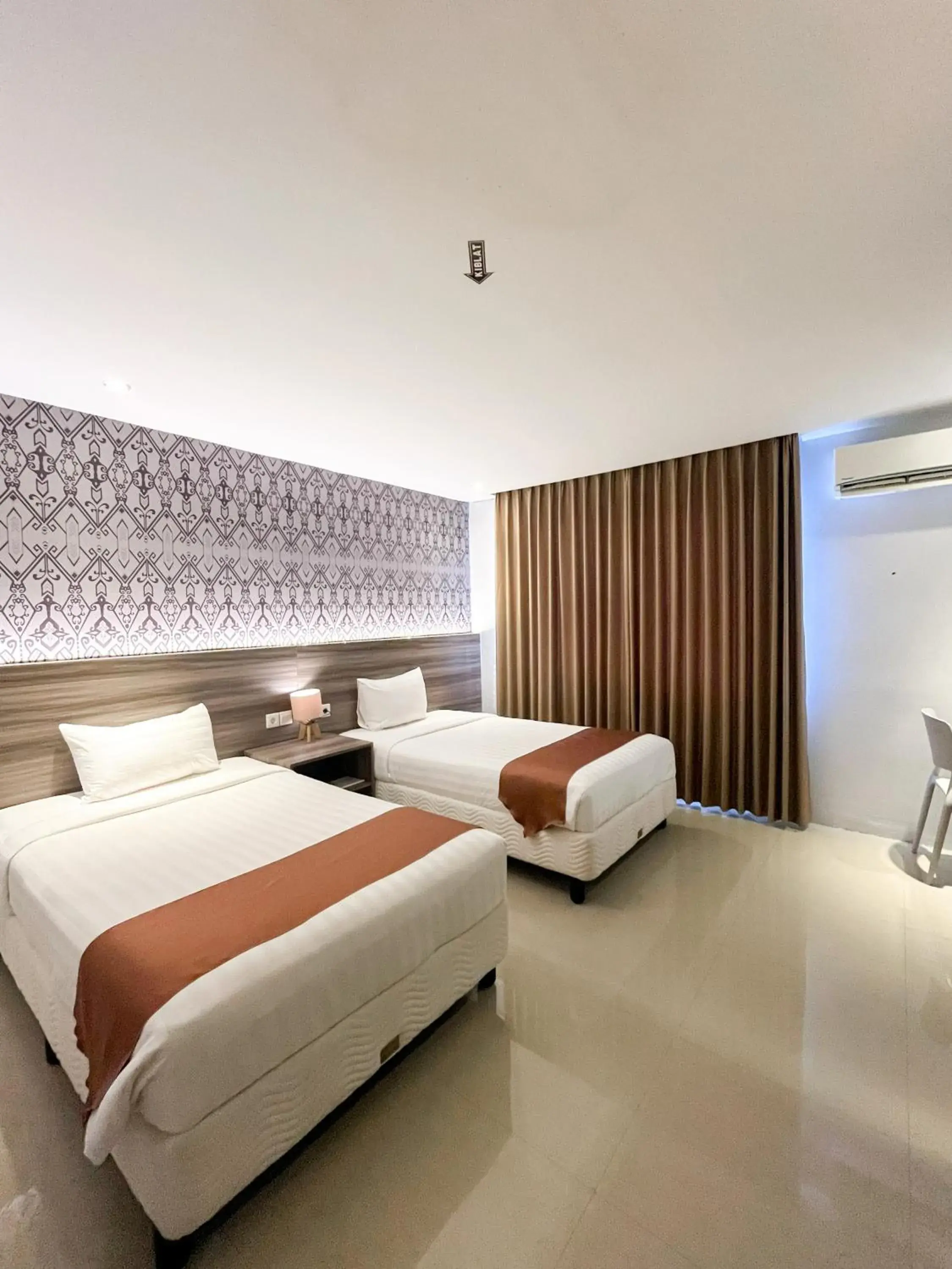 Bed in SM Tower Hotel and Convention Berau Bed in SM Tower Hotel and Convention Berau