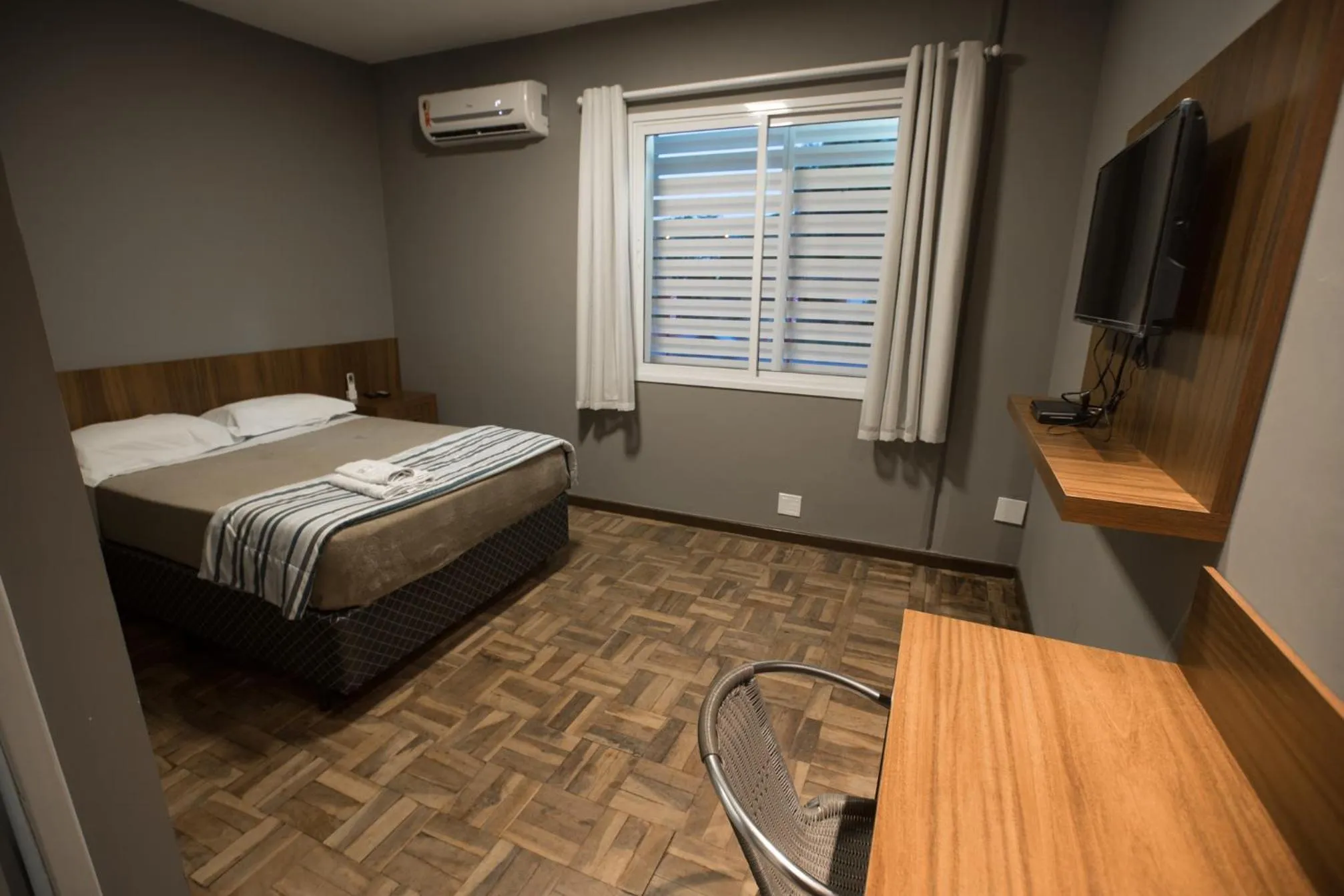 Bed in Ipê Hotel Express