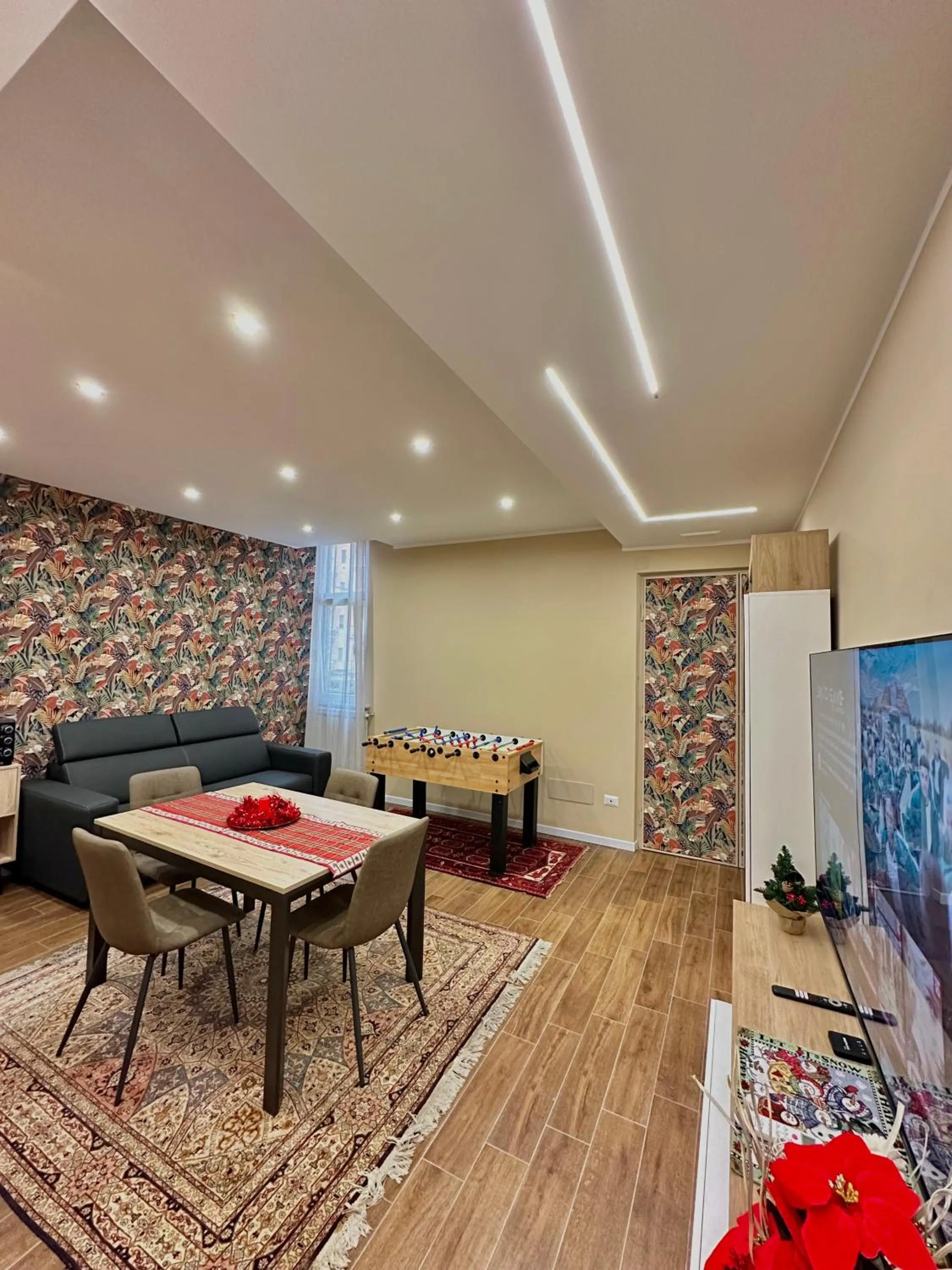 Communal lounge/ TV room in Casa Patrizia elegante dimora con biliardino
