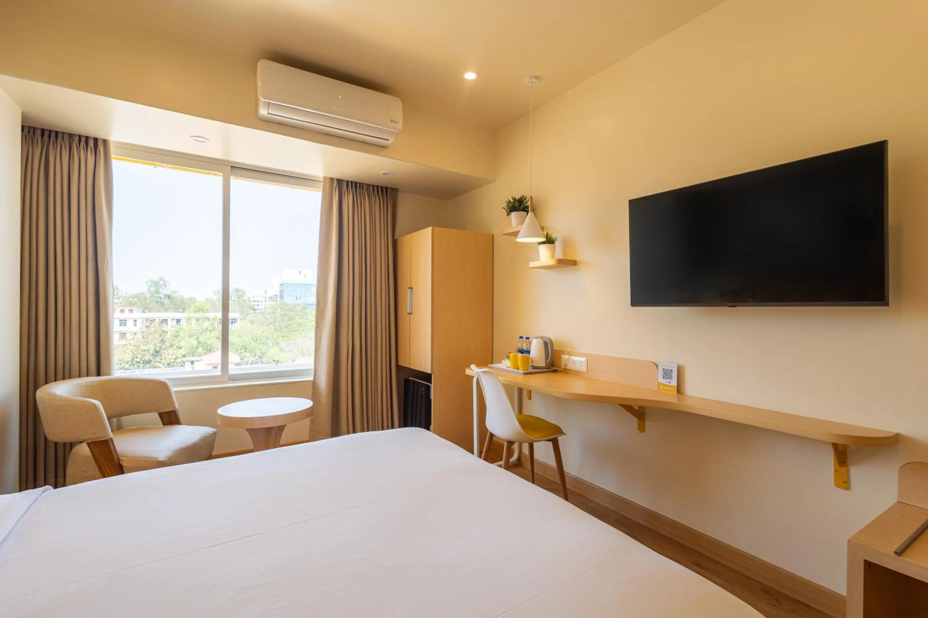 Photo of the whole room, Bed in Bloom Hotel - Ranchi