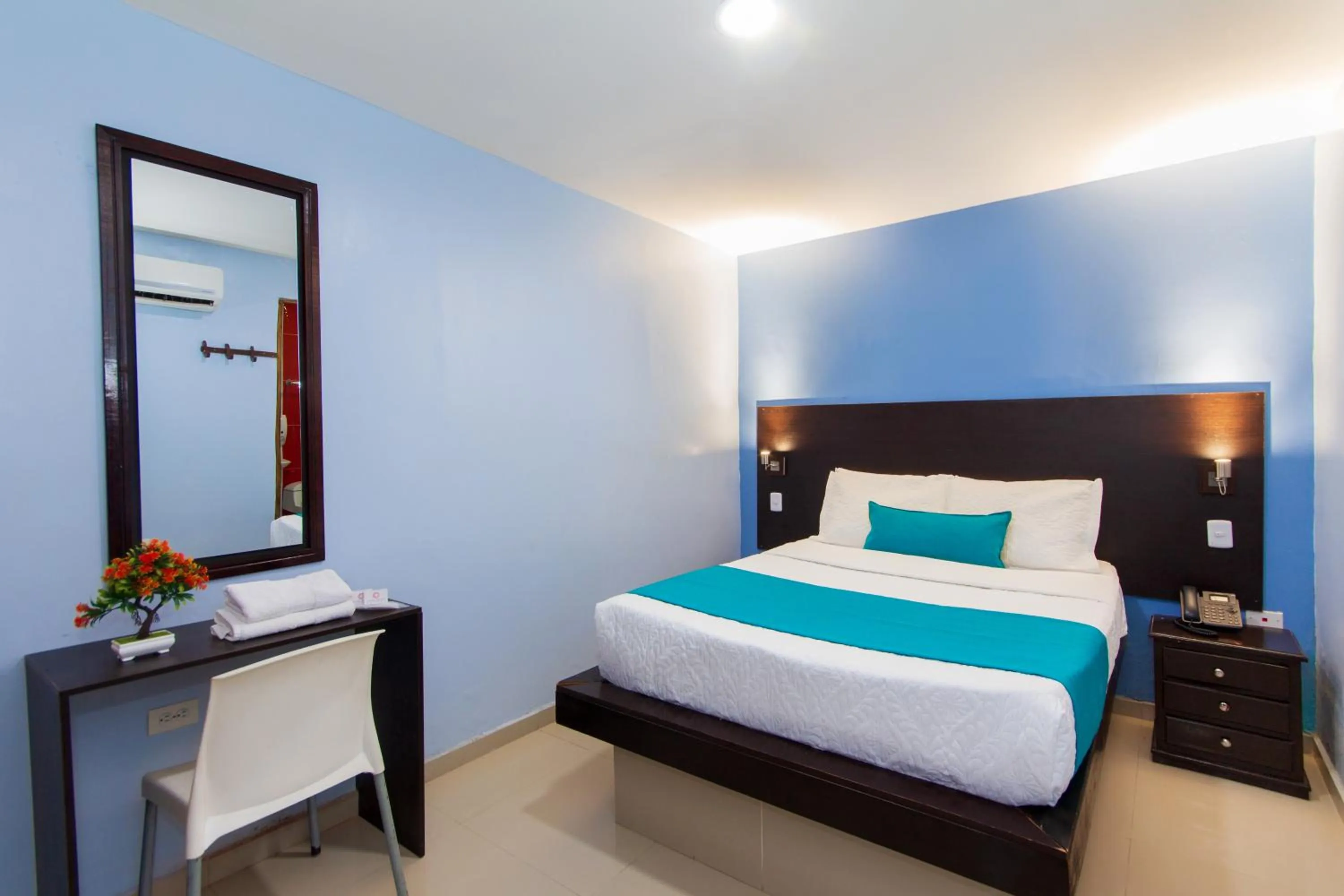 Bed in Azuán Suites Hotel By GEH Suites