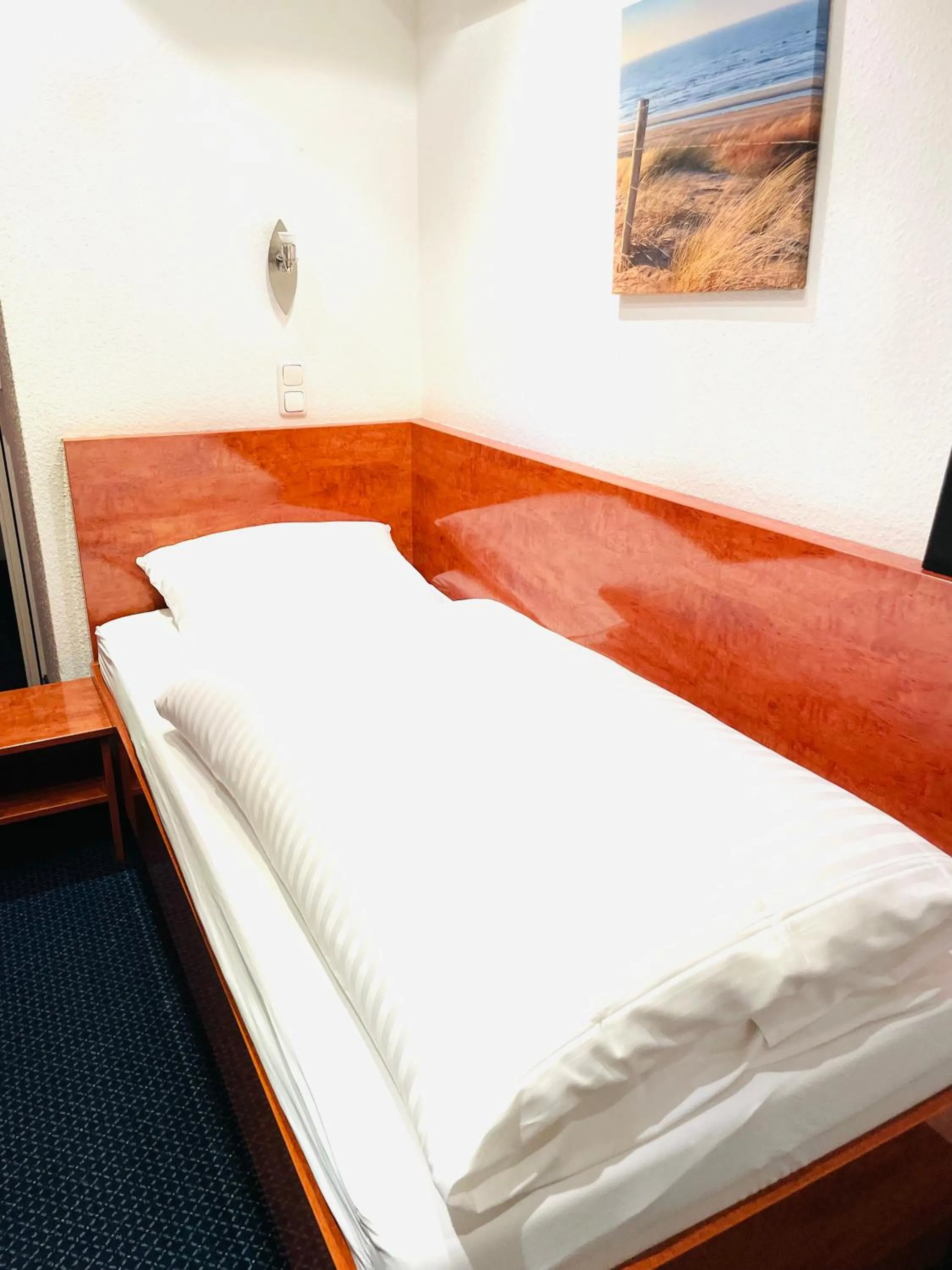 Bed in Hotel Merkenich