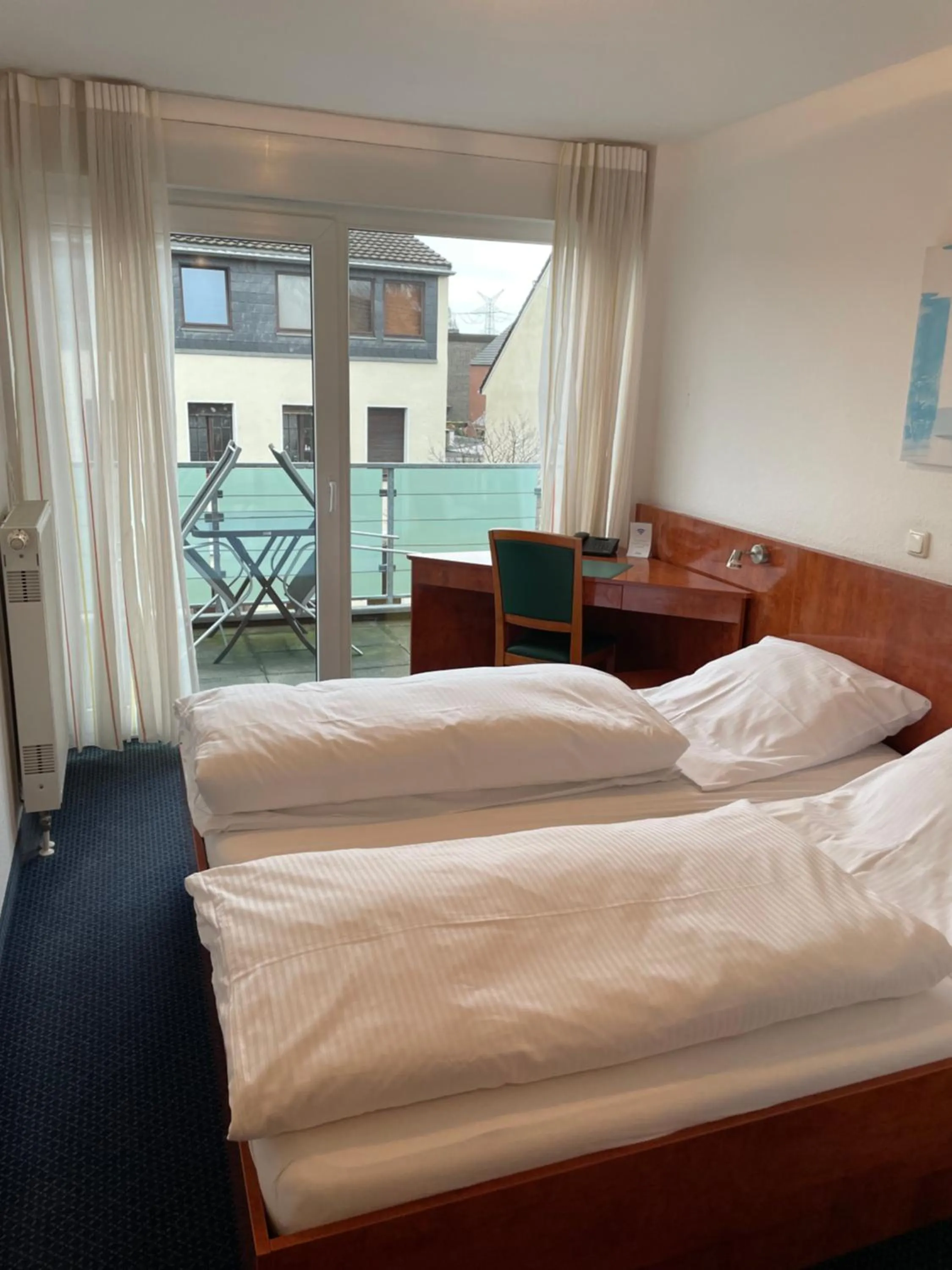 Bed in Hotel Merkenich