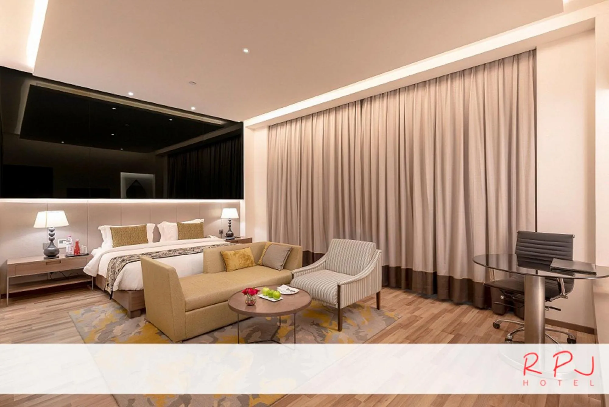 Seating area, Bed in RPJ Hotel Rajkot