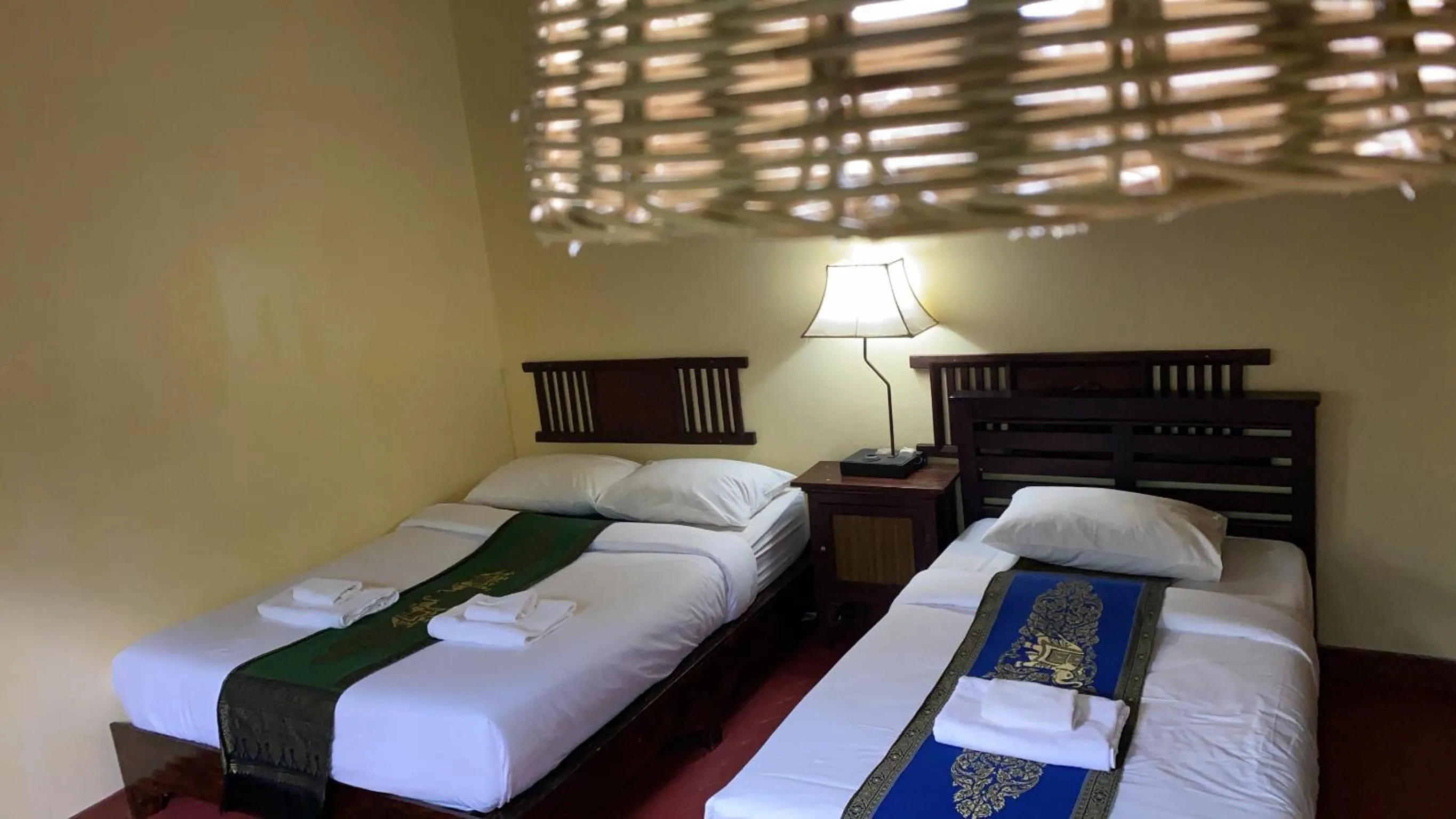 Bed in Golden Triangle Palace Hotel