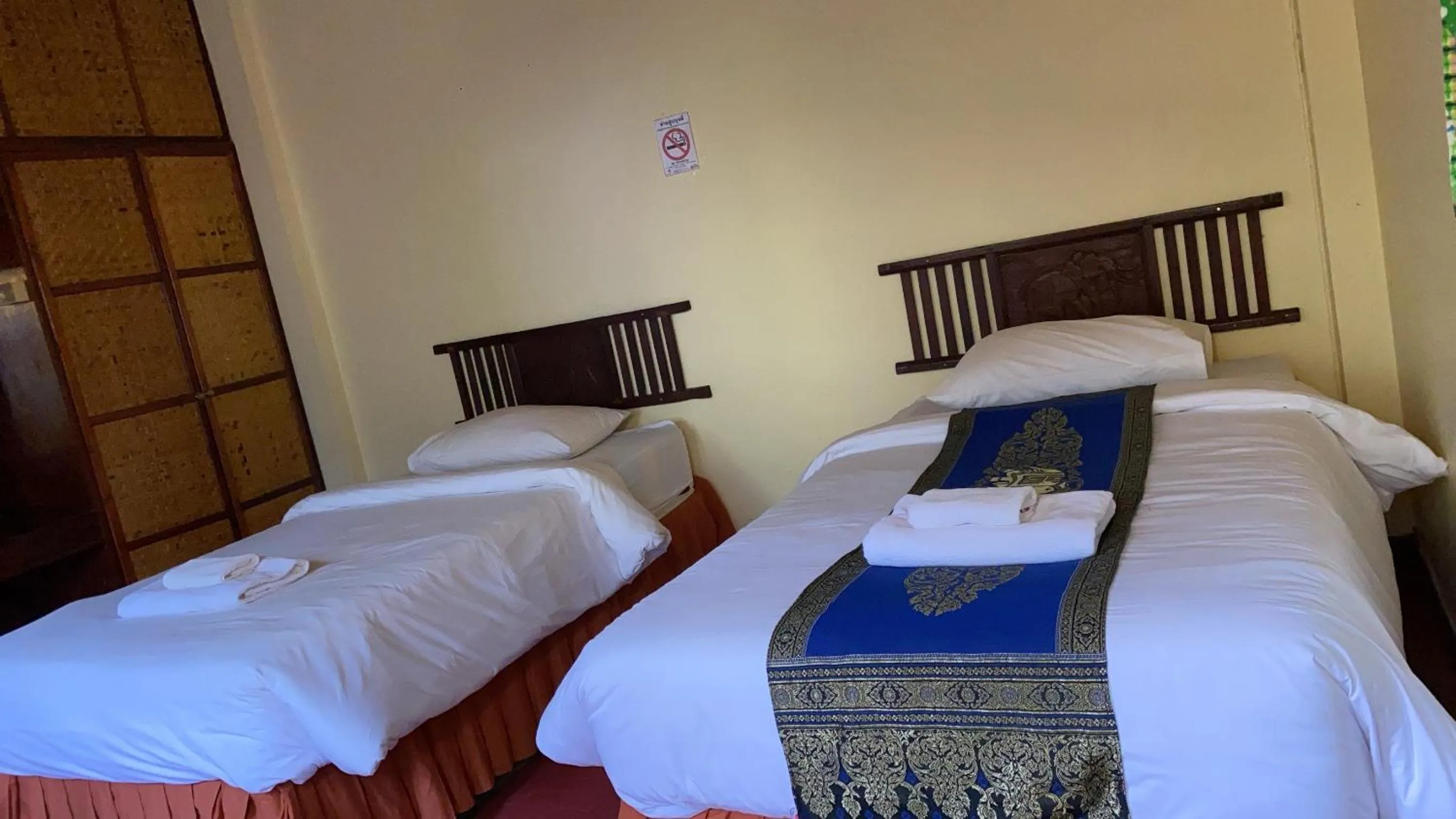 Bed in Golden Triangle Palace Hotel