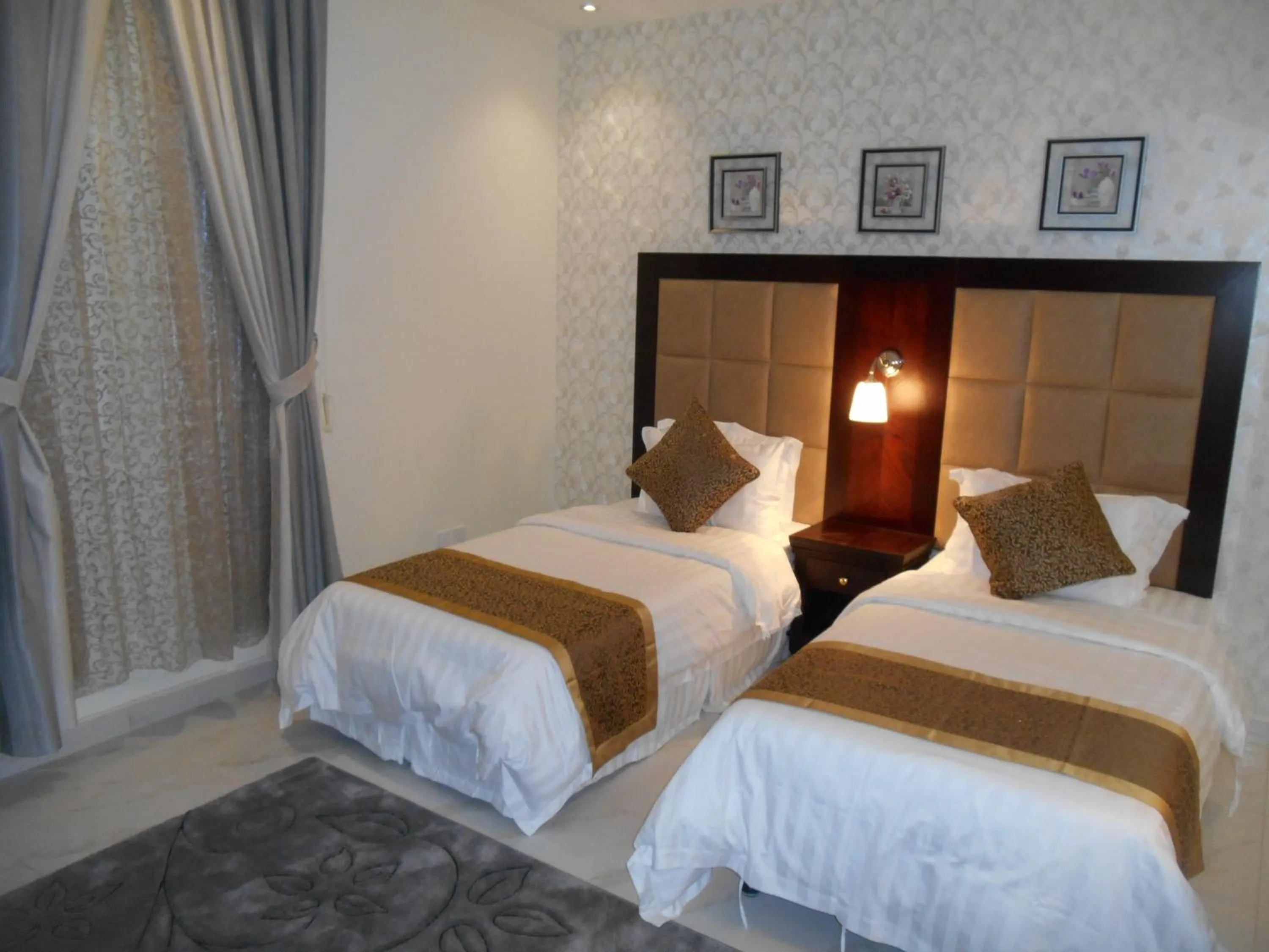 Bed in جلنار الشرق للشقق المخدومة