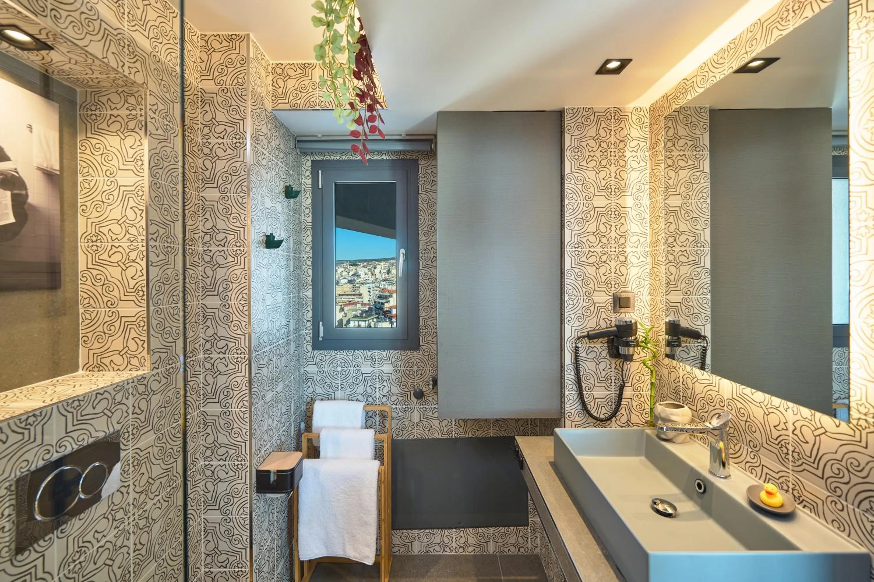 Bathroom in SIGMA Suites Hotel