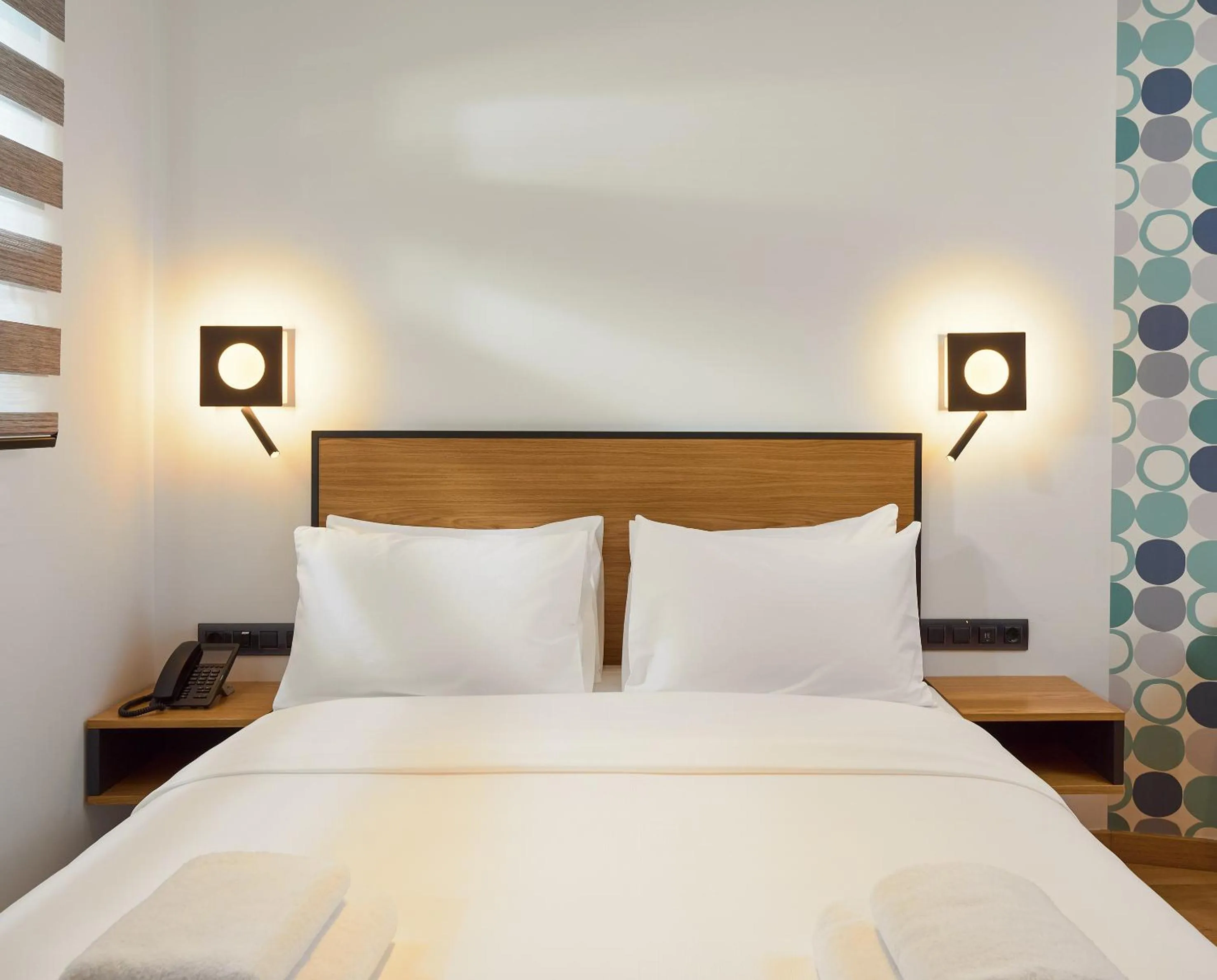 Bed in SIGMA Suites Hotel