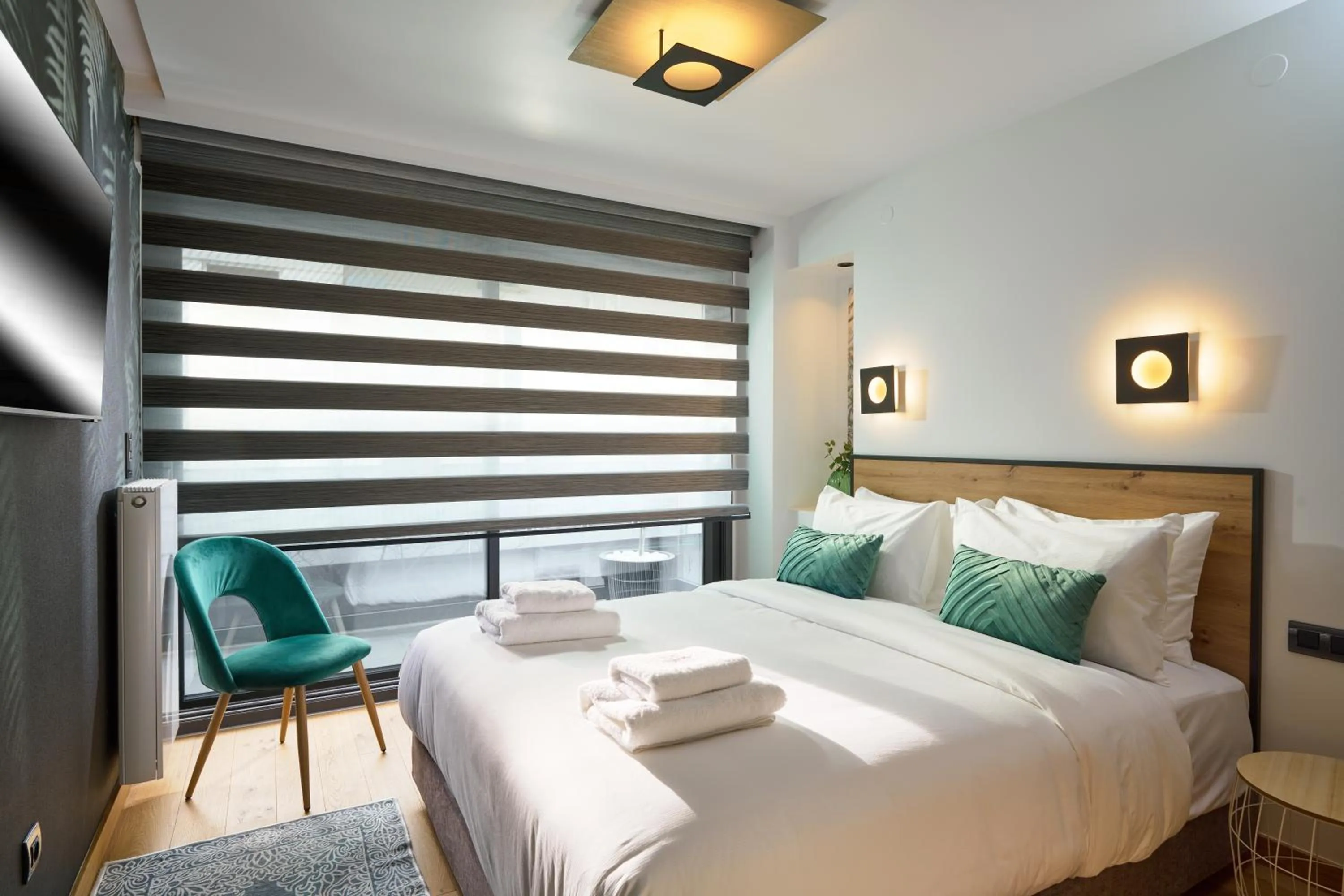 Bed in SIGMA Suites Hotel