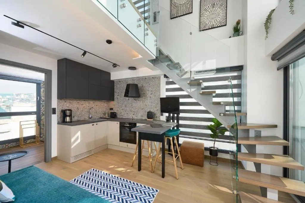 Kitchen or kitchenette in SIGMA Suites Hotel