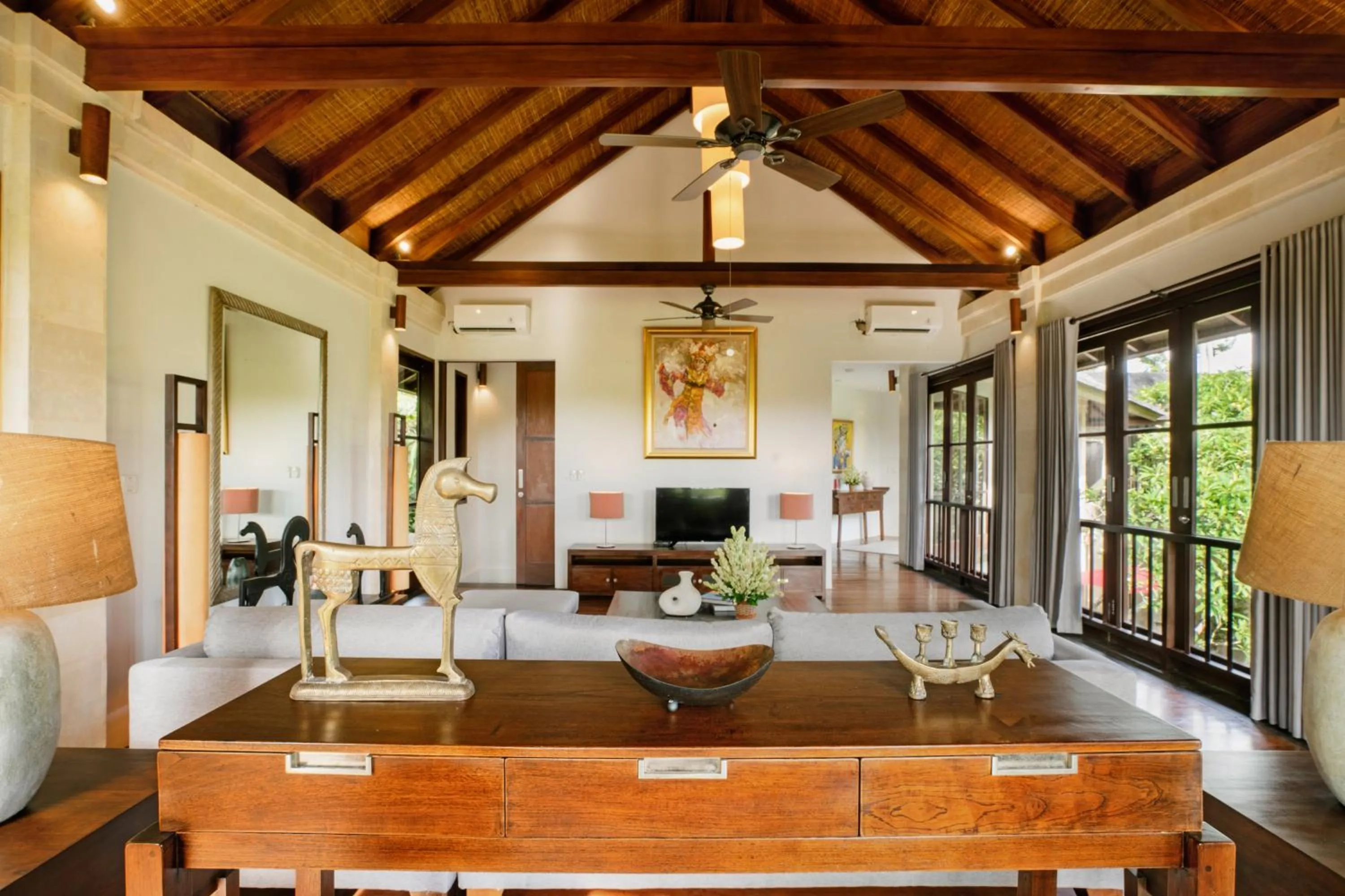 Communal lounge/ TV room in Villa Pulung Jimbaran by Nakula