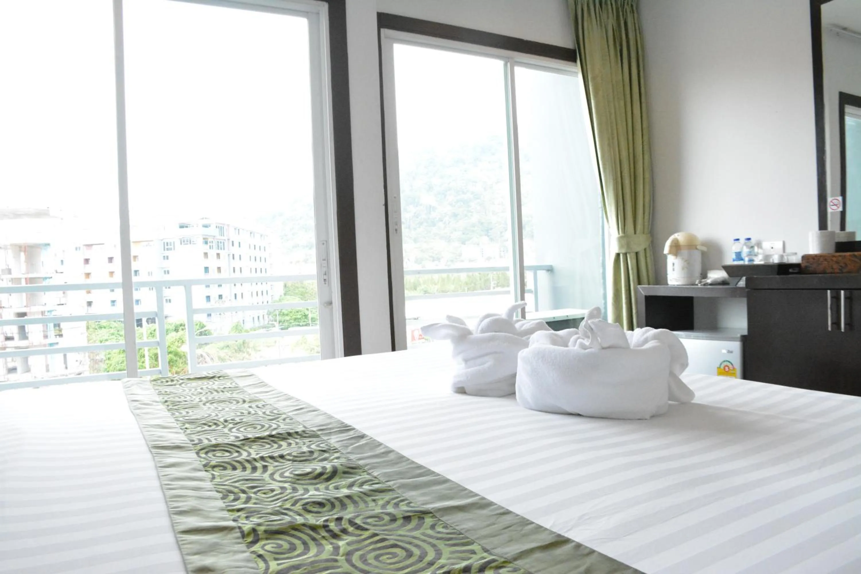 Bed in Zephyr Grand Hotel