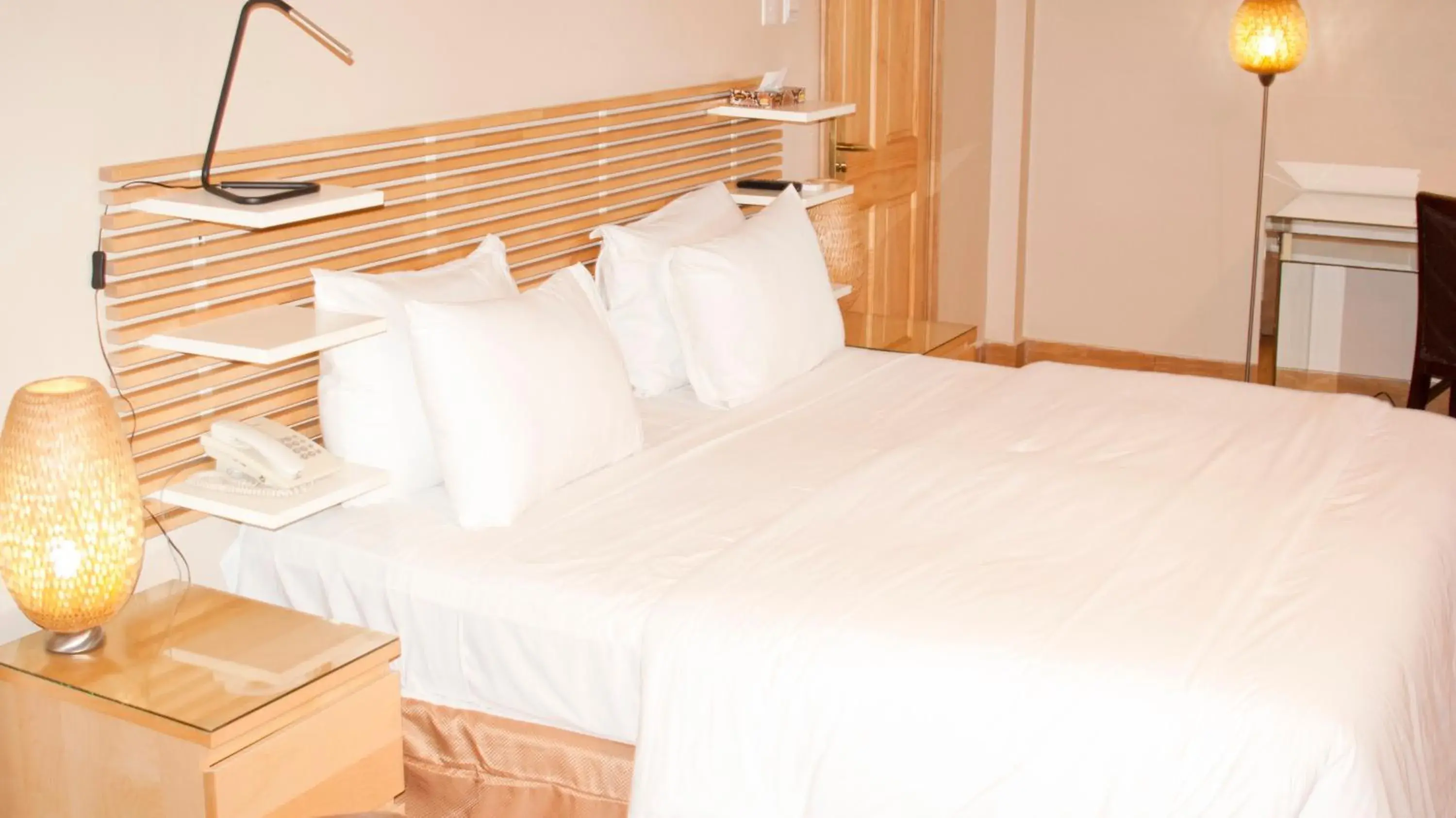 Bed in Tropical Enclave Hotel Bed in Tropical Enclave Hotel