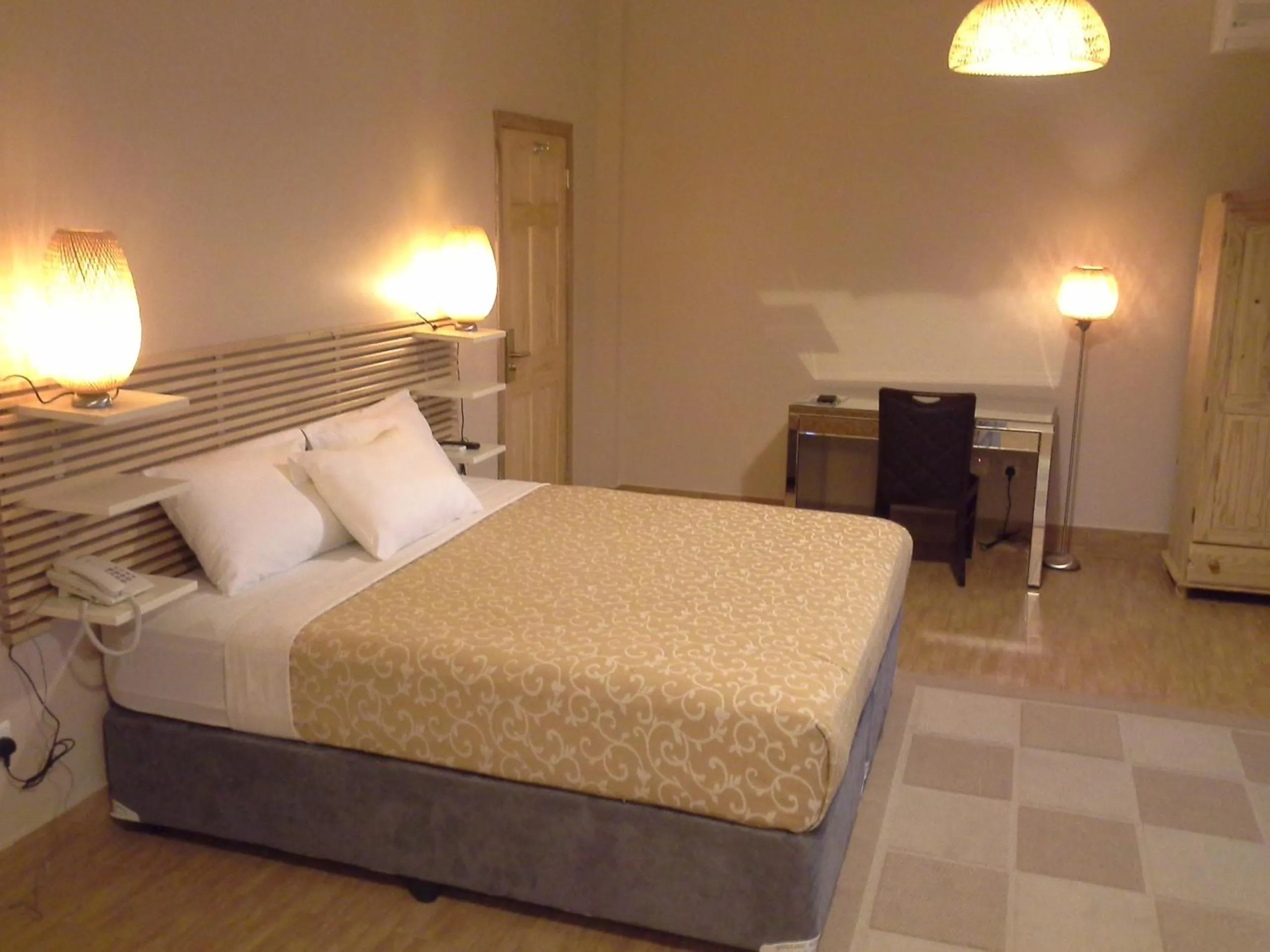 Photo of the whole room, Bed in Tropical Enclave Hotel