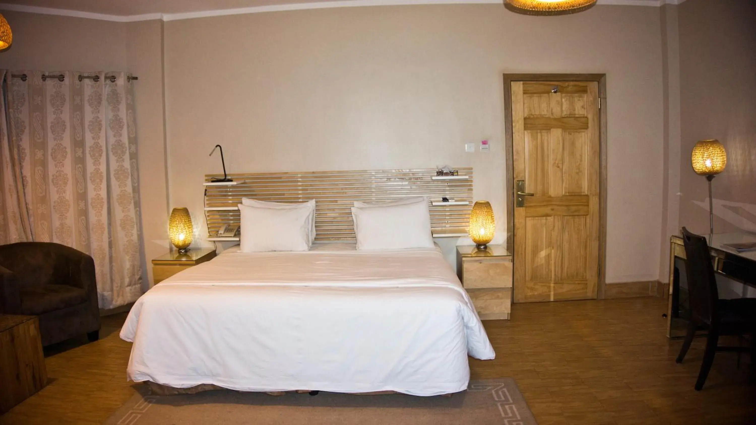 Photo of the whole room, Bed in Tropical Enclave Hotel Photo of the whole room, Bed in Tropical Enclave Hotel