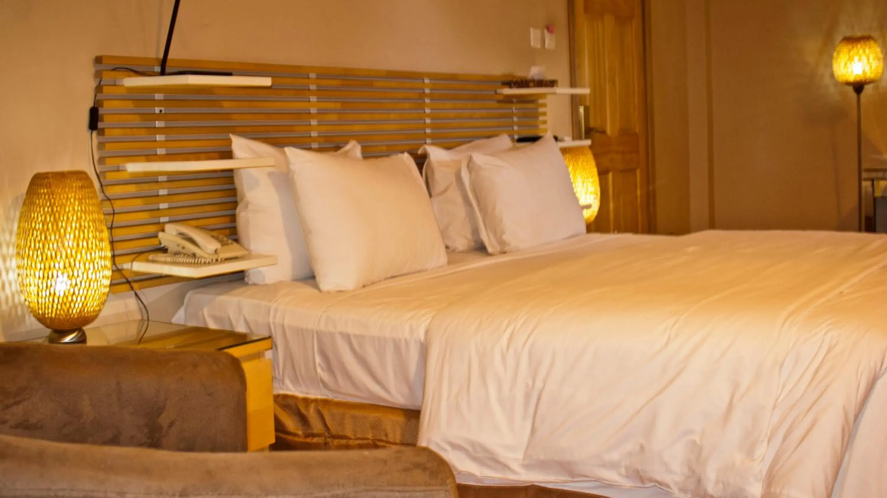 Bed in Tropical Enclave Hotel Bed in Tropical Enclave Hotel