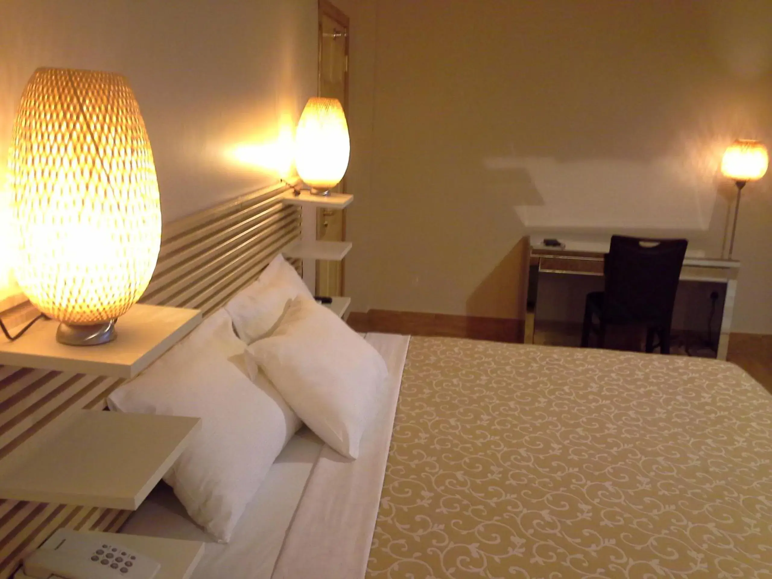 Bed in Tropical Enclave Hotel Bed in Tropical Enclave Hotel