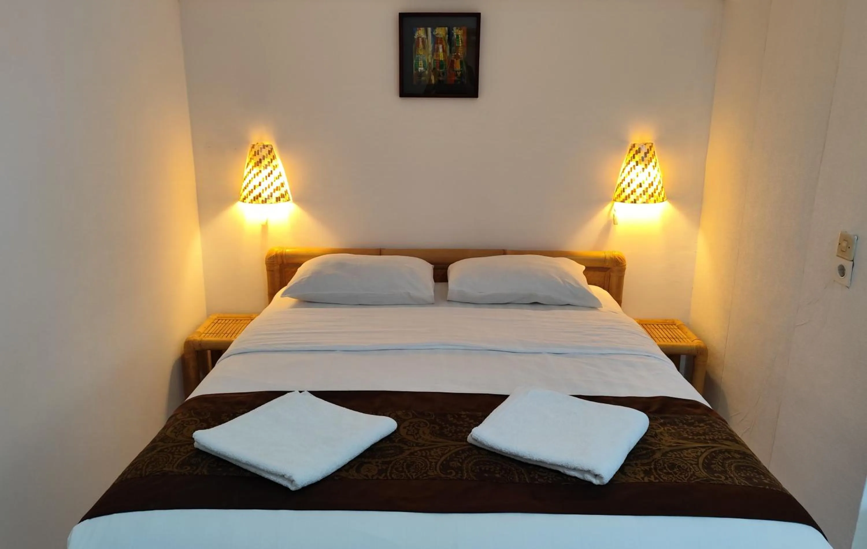 Bed in Keyani Bungalows Lovina