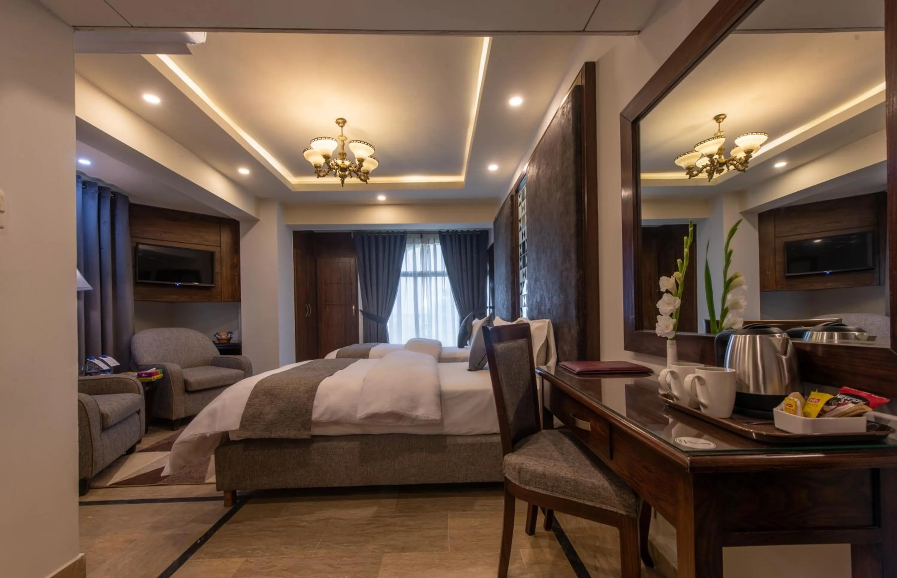 Photo of the whole room, Bed in Envoy Continental Hotel, Blue Area, Islamabad