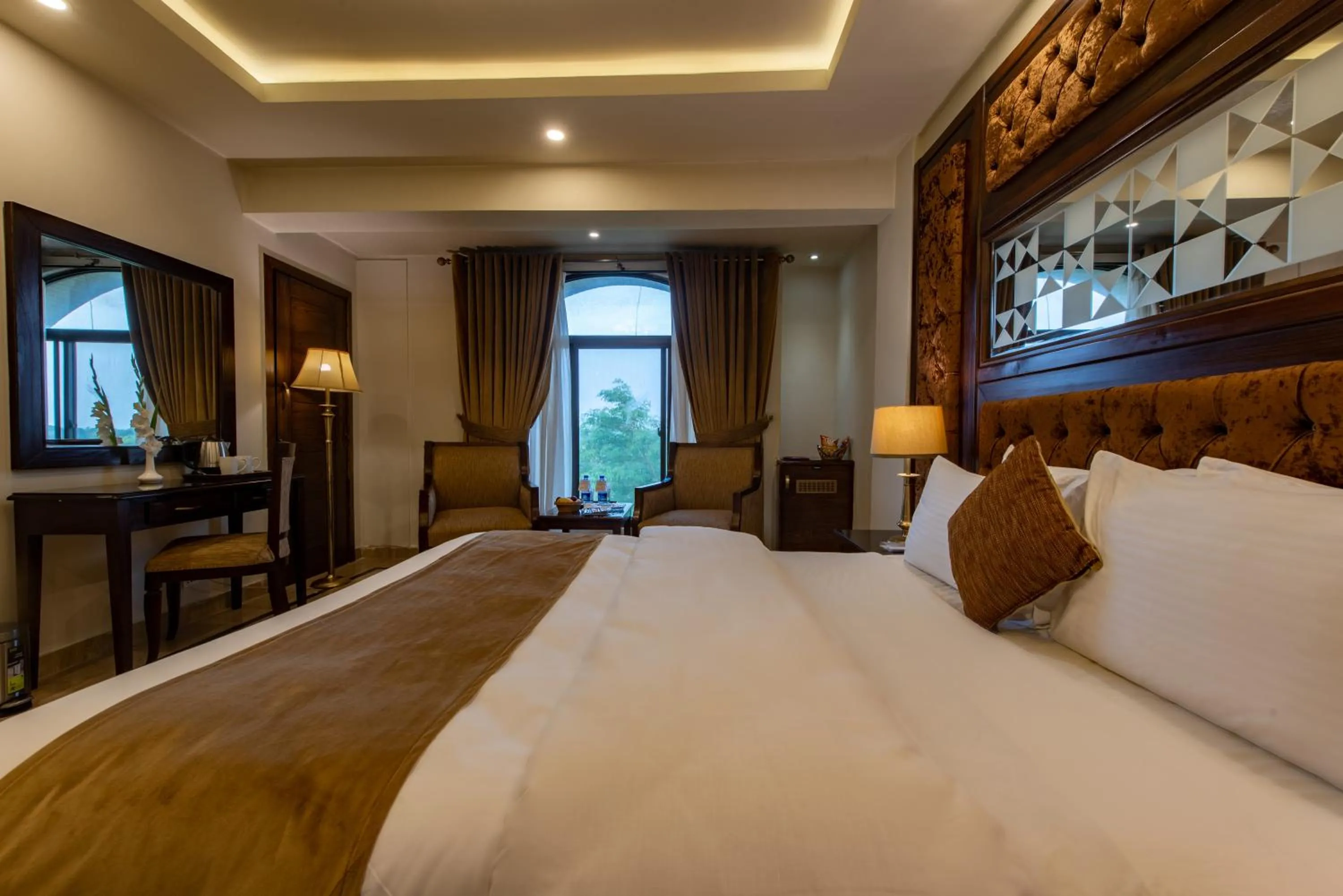 Seating area, Bed in Envoy Continental Hotel, Blue Area, Islamabad