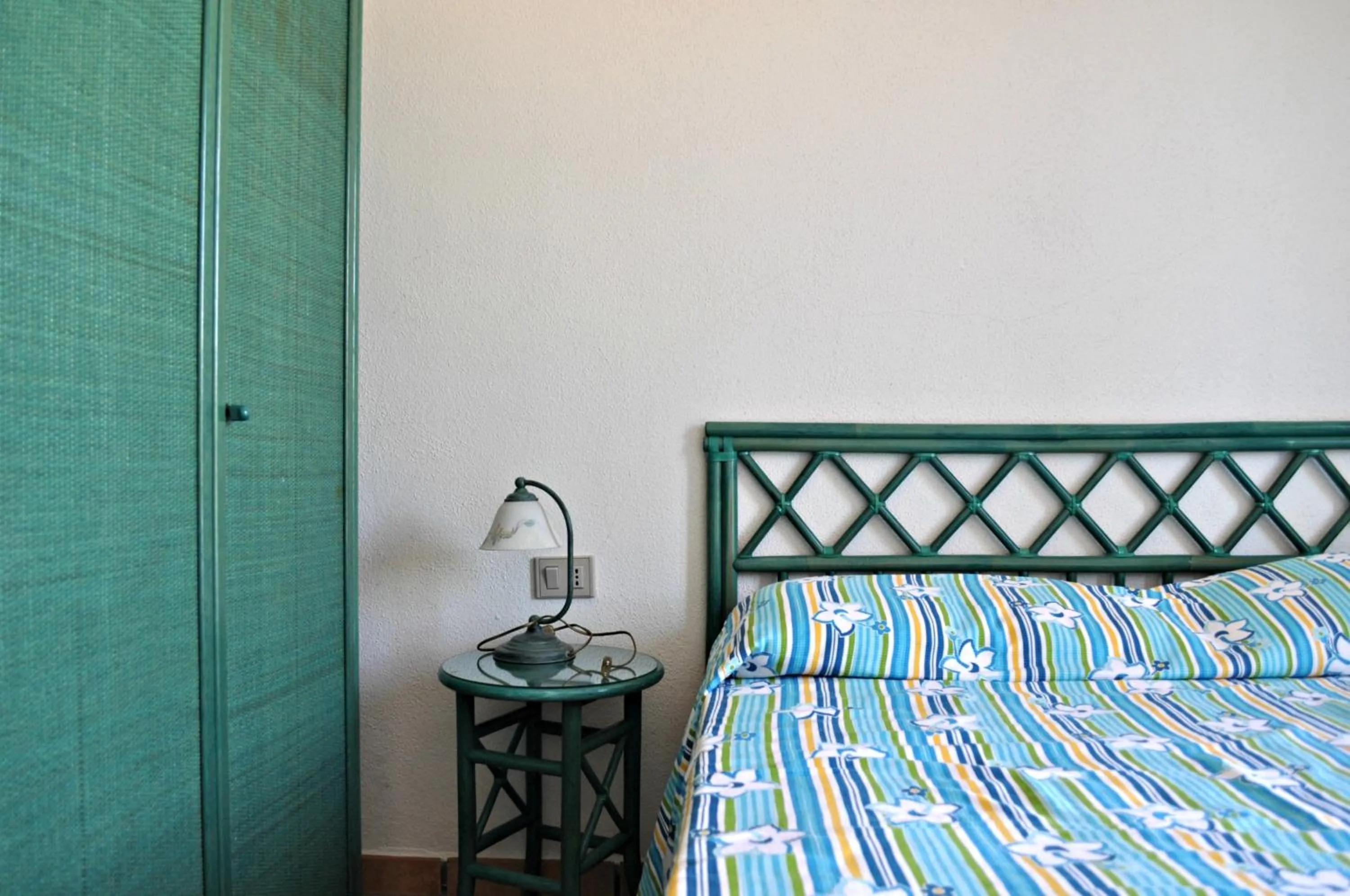 Decorative detail, Bed in Stella Marina Budoni