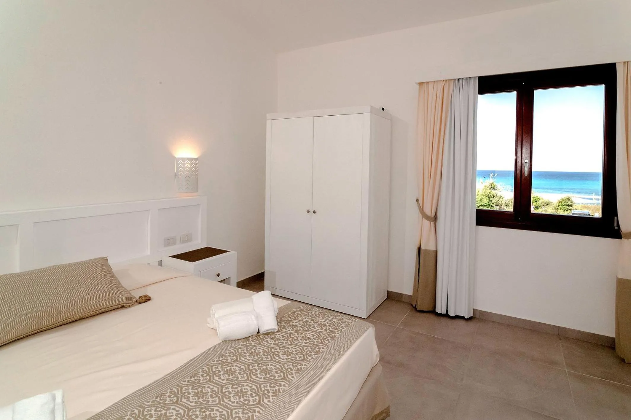 Bed in Stella Marina Budoni