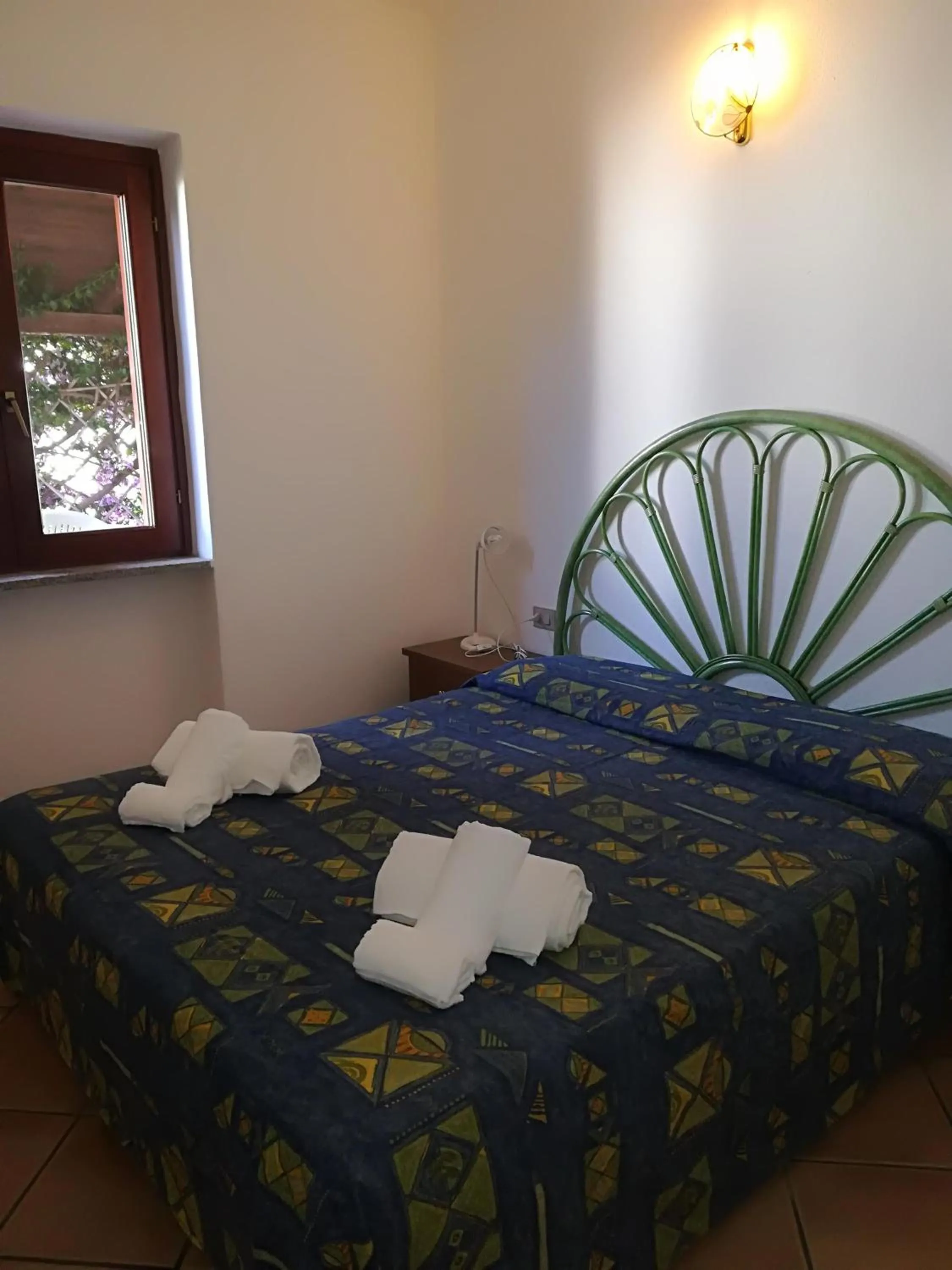 Bed in Stella Marina Budoni