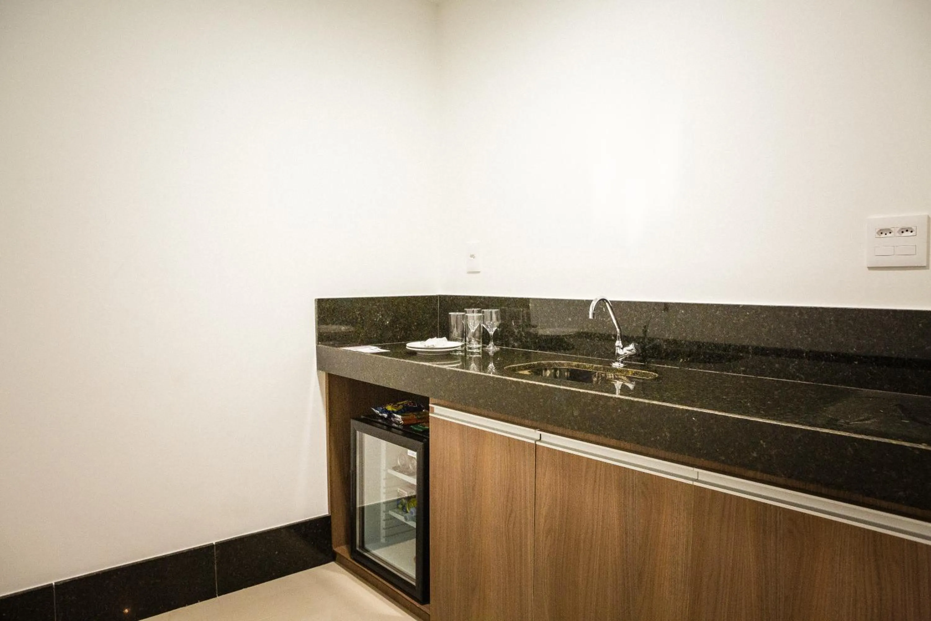 Kitchen or kitchenette in San Diego Suítes Governador Valadares