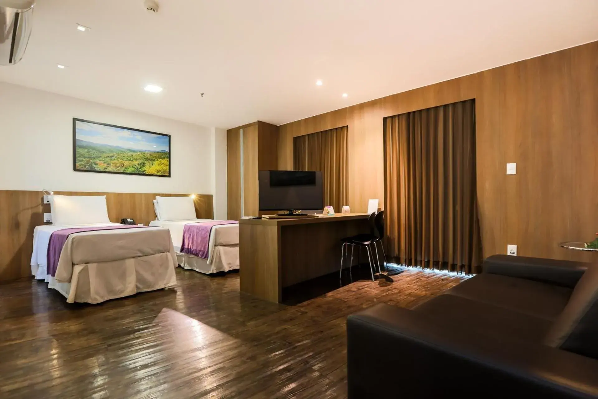 Living room, Bed in San Diego Suítes Governador Valadares Living room, Bed in San Diego Suítes Governador Valadares