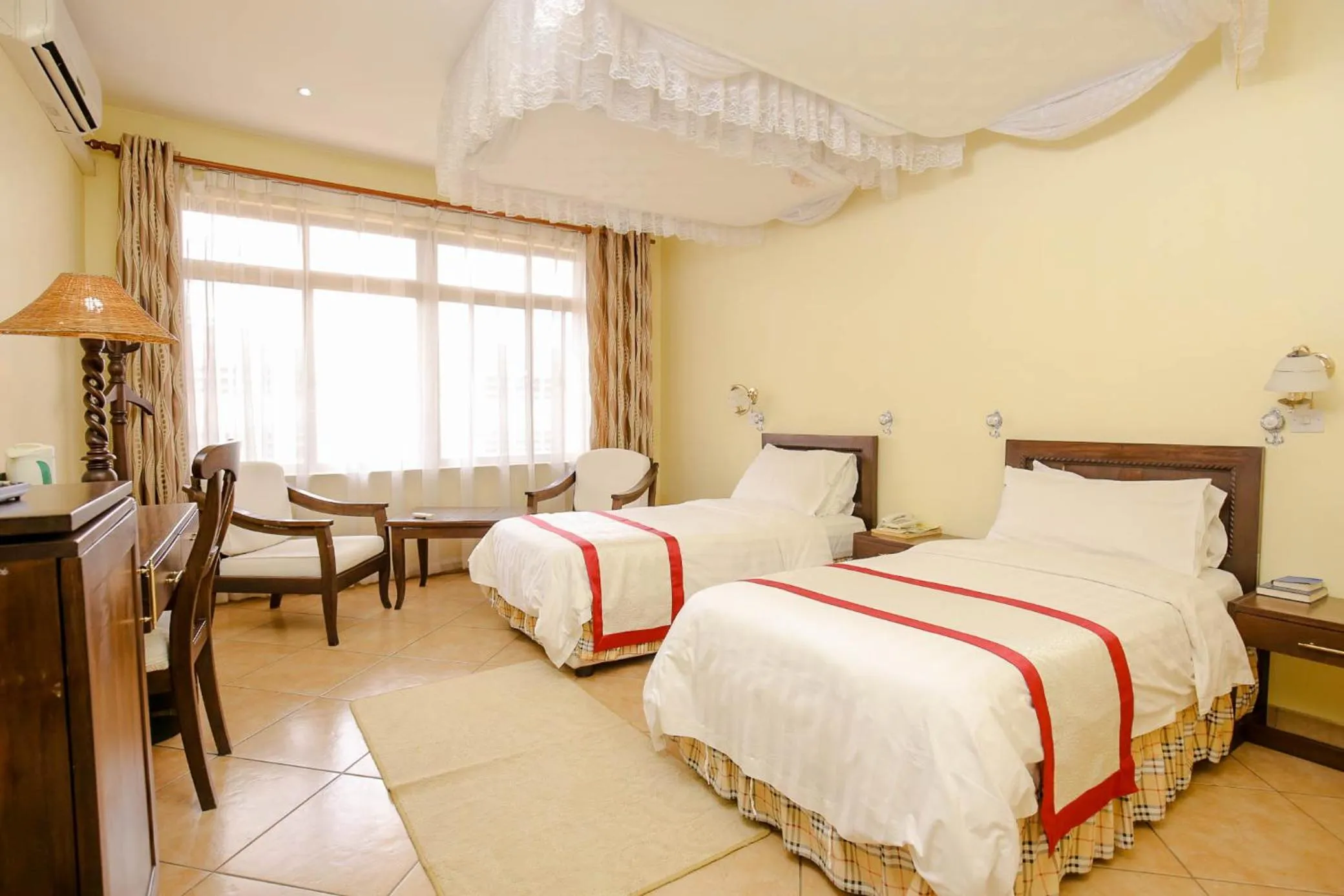 Bed in New Safari Hotel