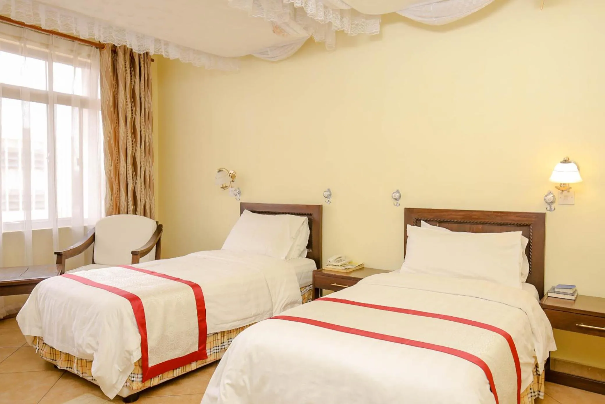 Bed in New Safari Hotel