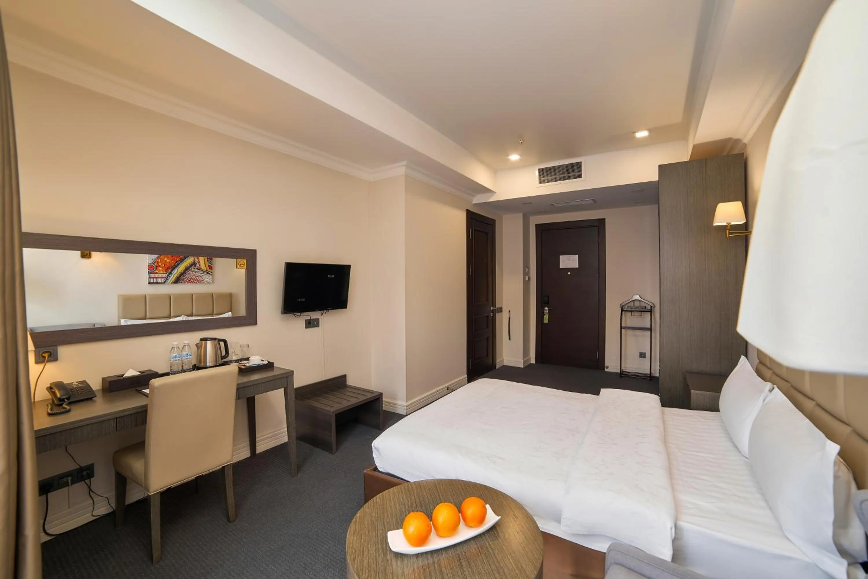 Bed in Ambassador Hotel