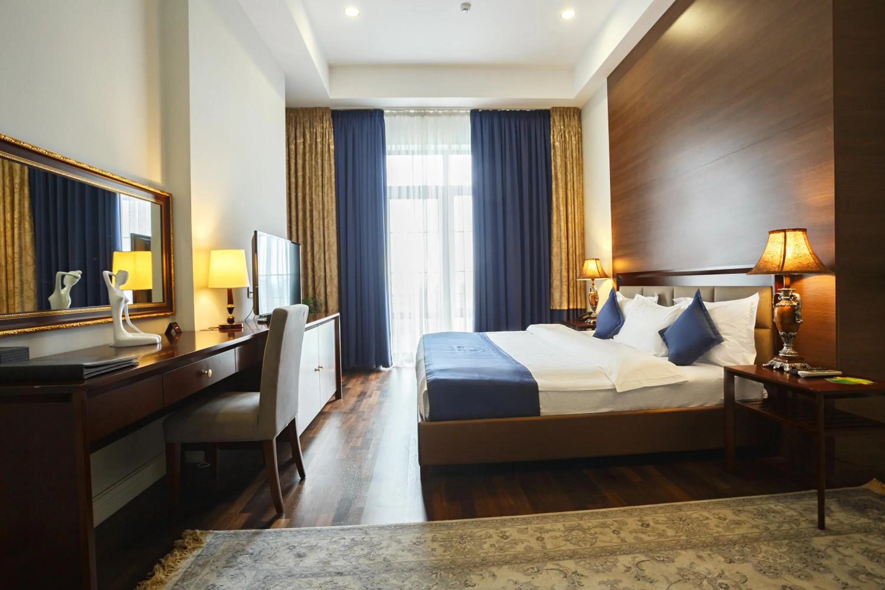 Bed in Ambassador Hotel