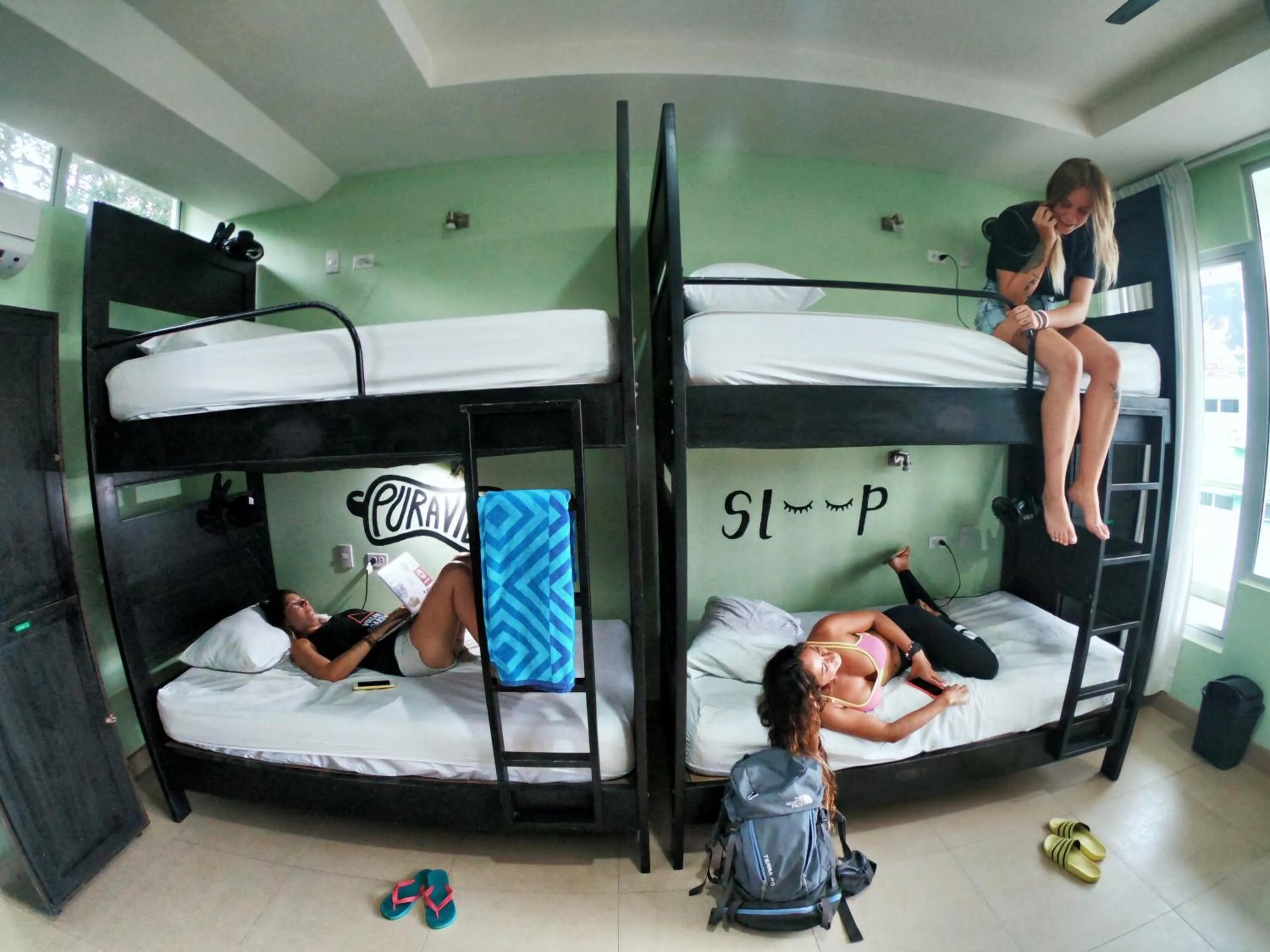 Bed in 8-Bed Dormitory Room with Shared Shower in Room2Board Hostel and Surf School