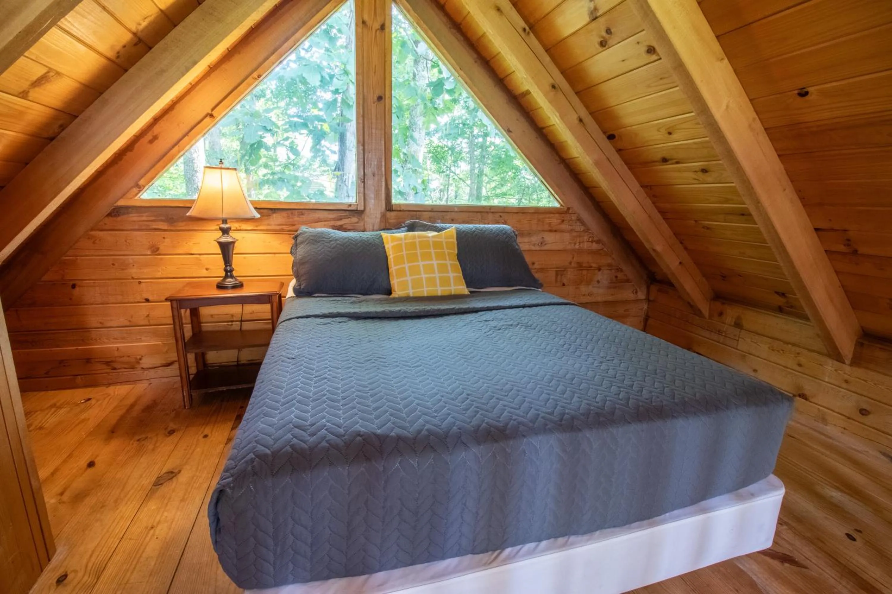 Bed in Kozy Haven Log Cabin Rentals