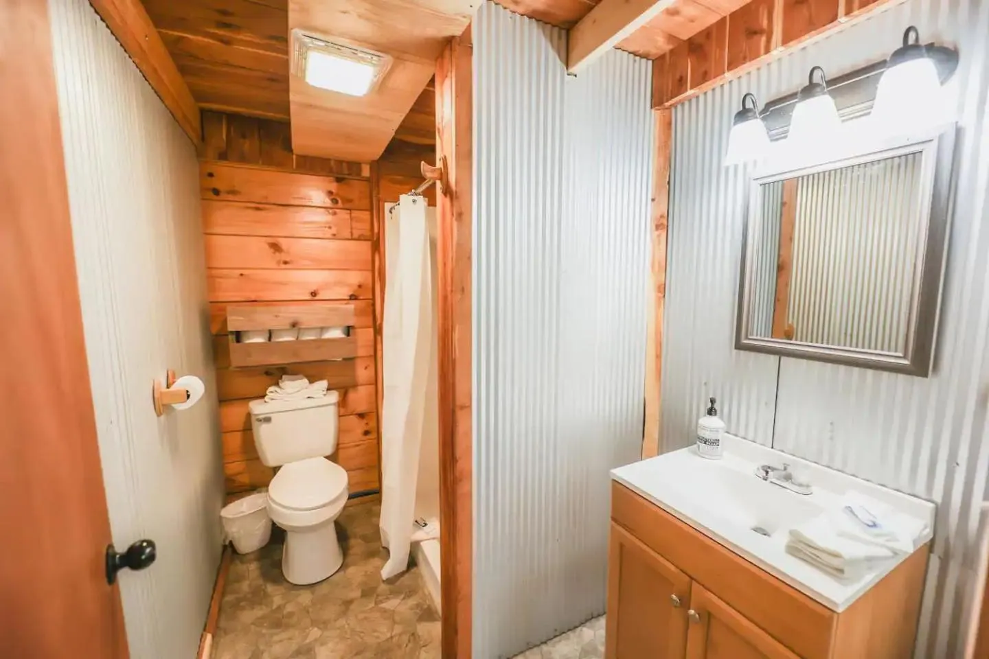 Toilet in Kozy Haven Log Cabin Rentals