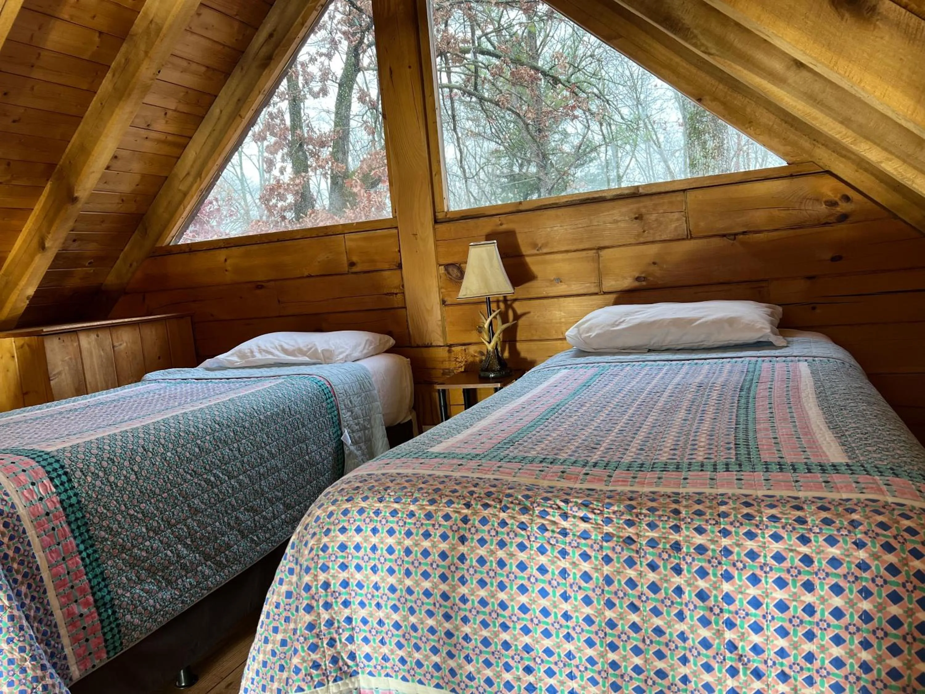 Bed in Kozy Haven Log Cabin Rentals