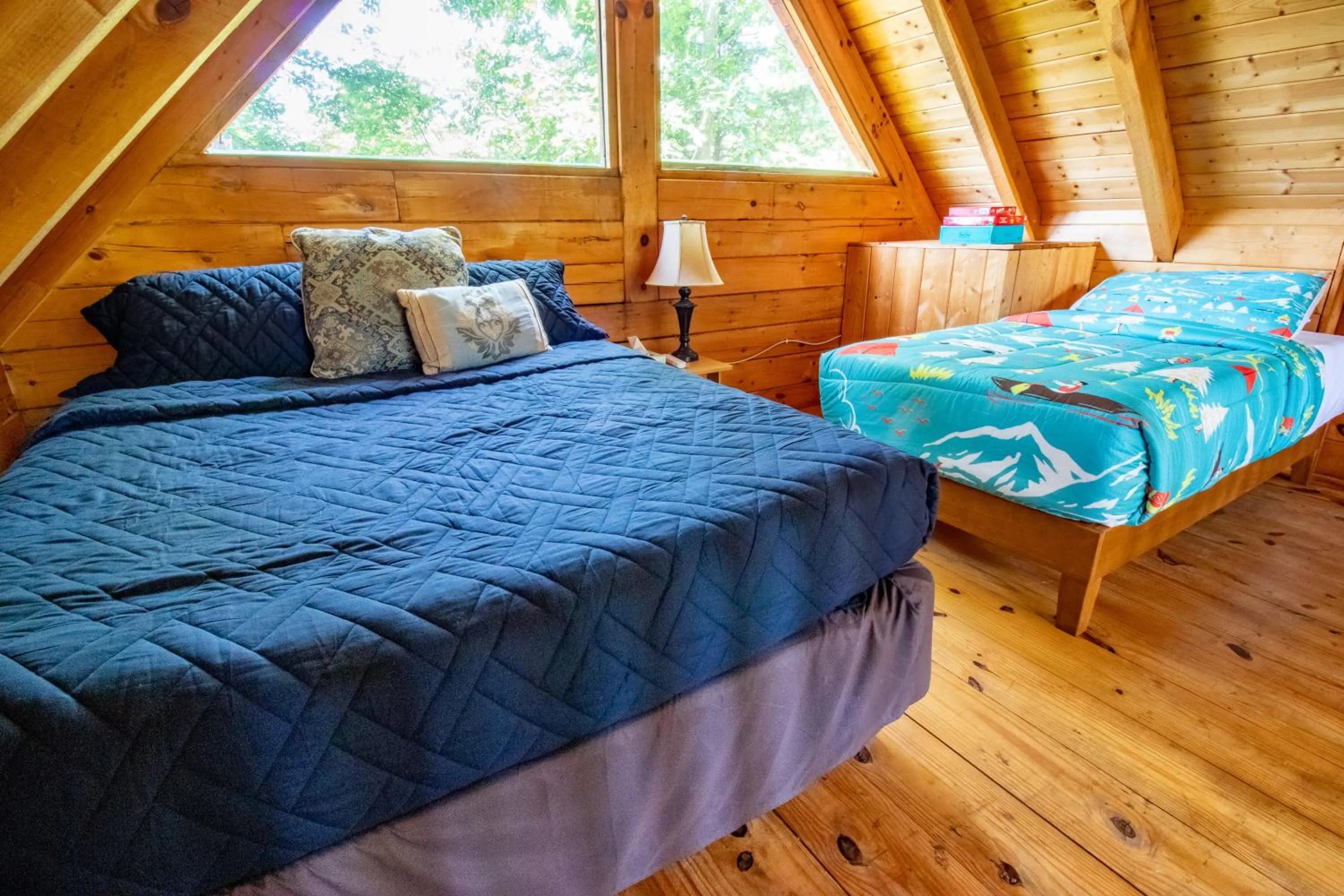 Bed in Kozy Haven Log Cabin Rentals