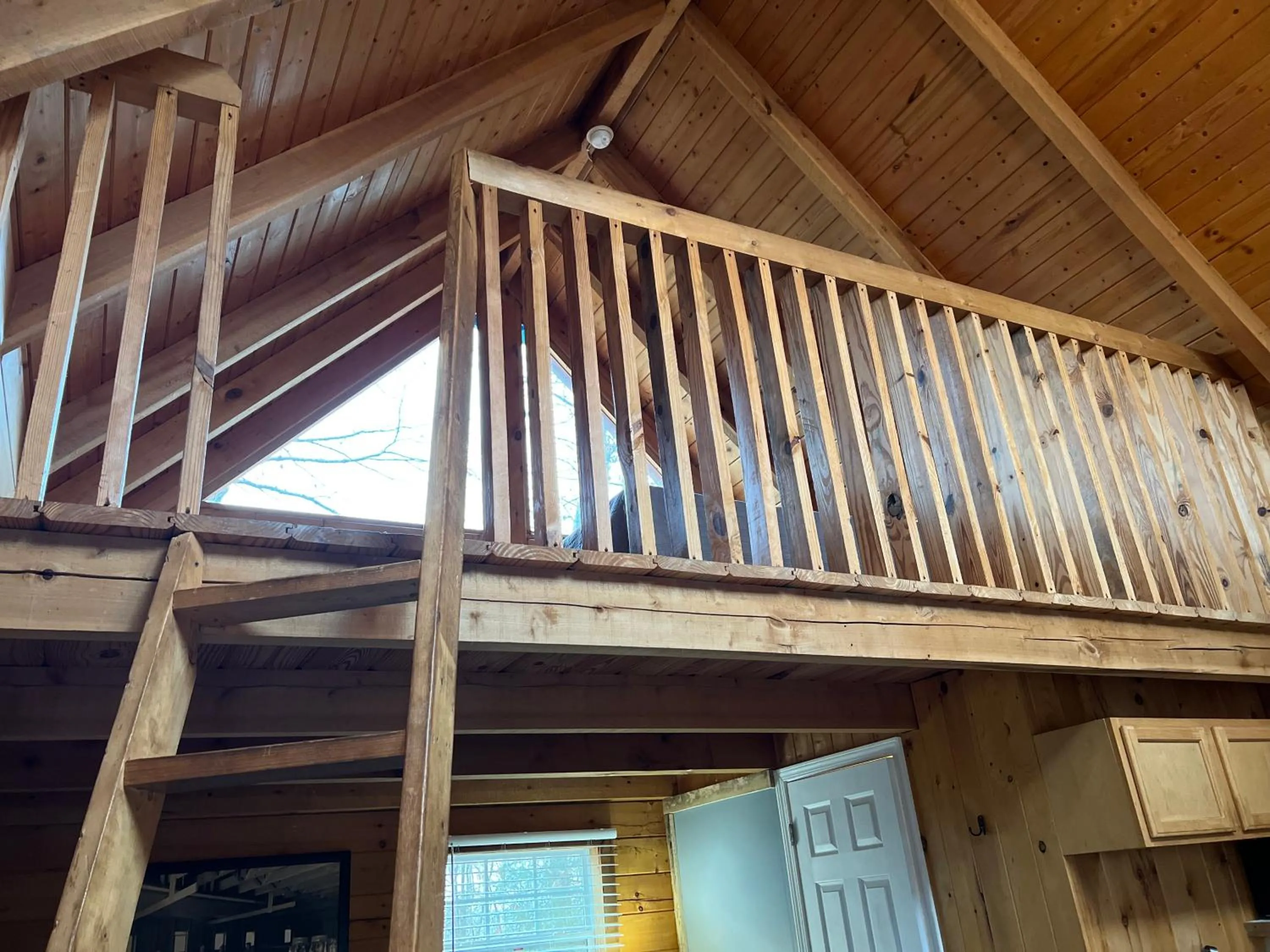 Bedroom in Kozy Haven Log Cabin Rentals