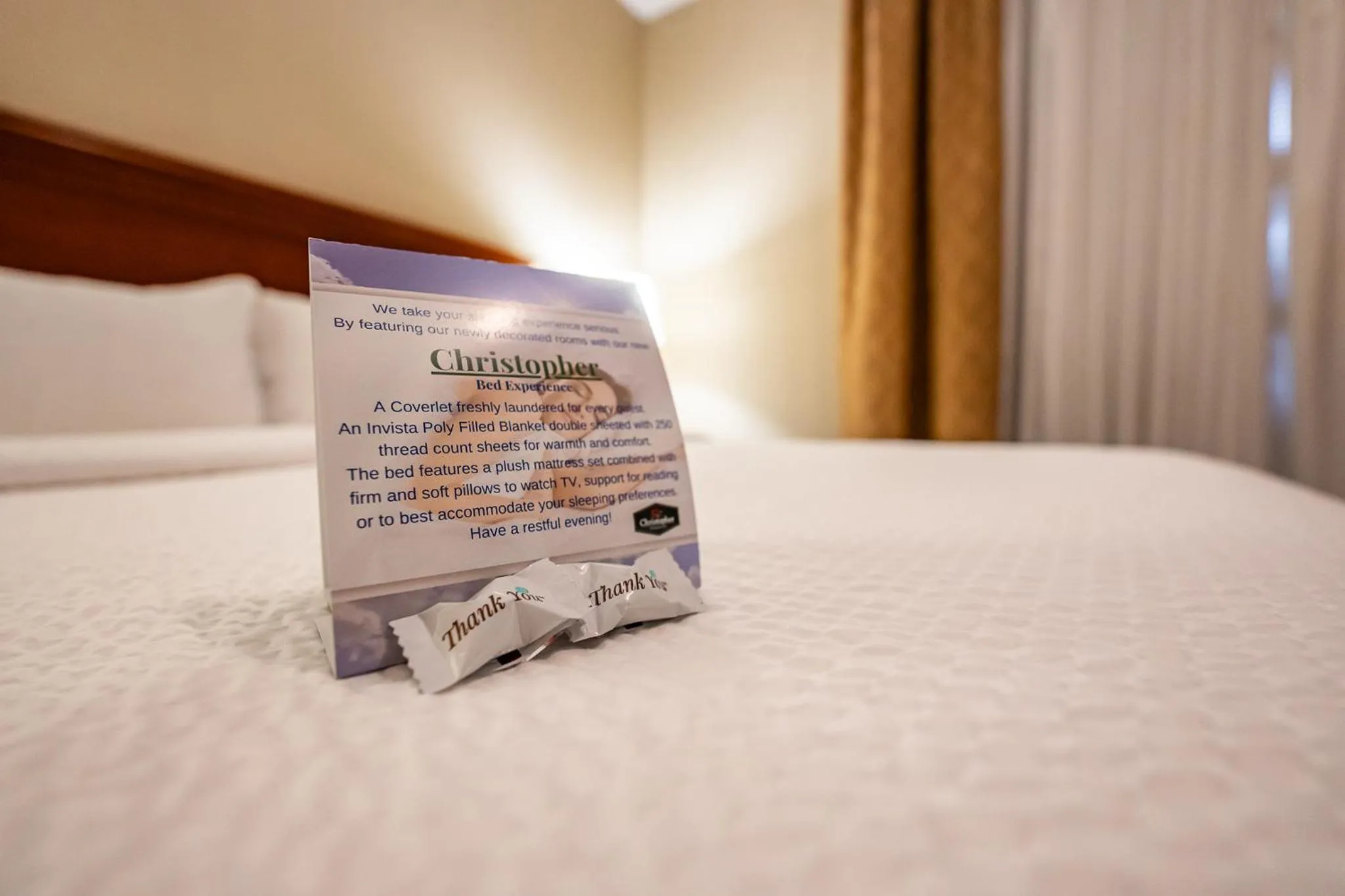 Bed in Christopher Inn and Suites