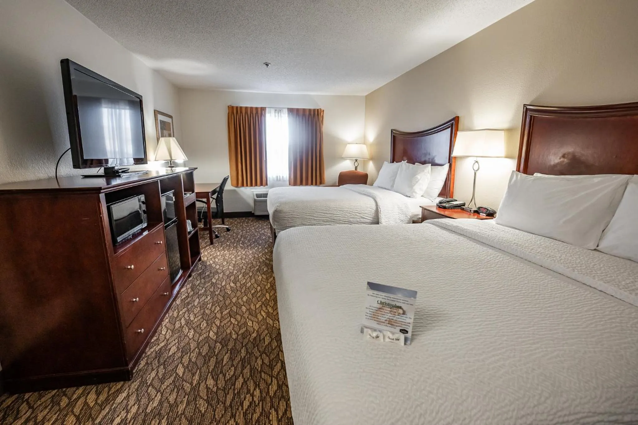 Bed in Christopher Inn and Suites