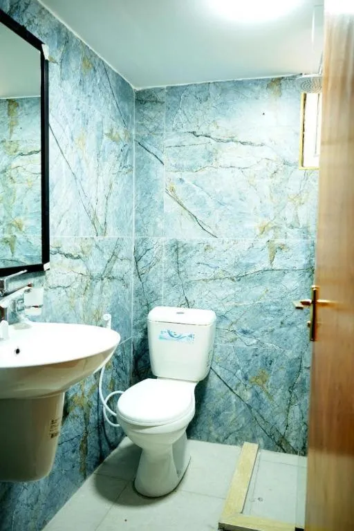 Shower in Conord Hotel