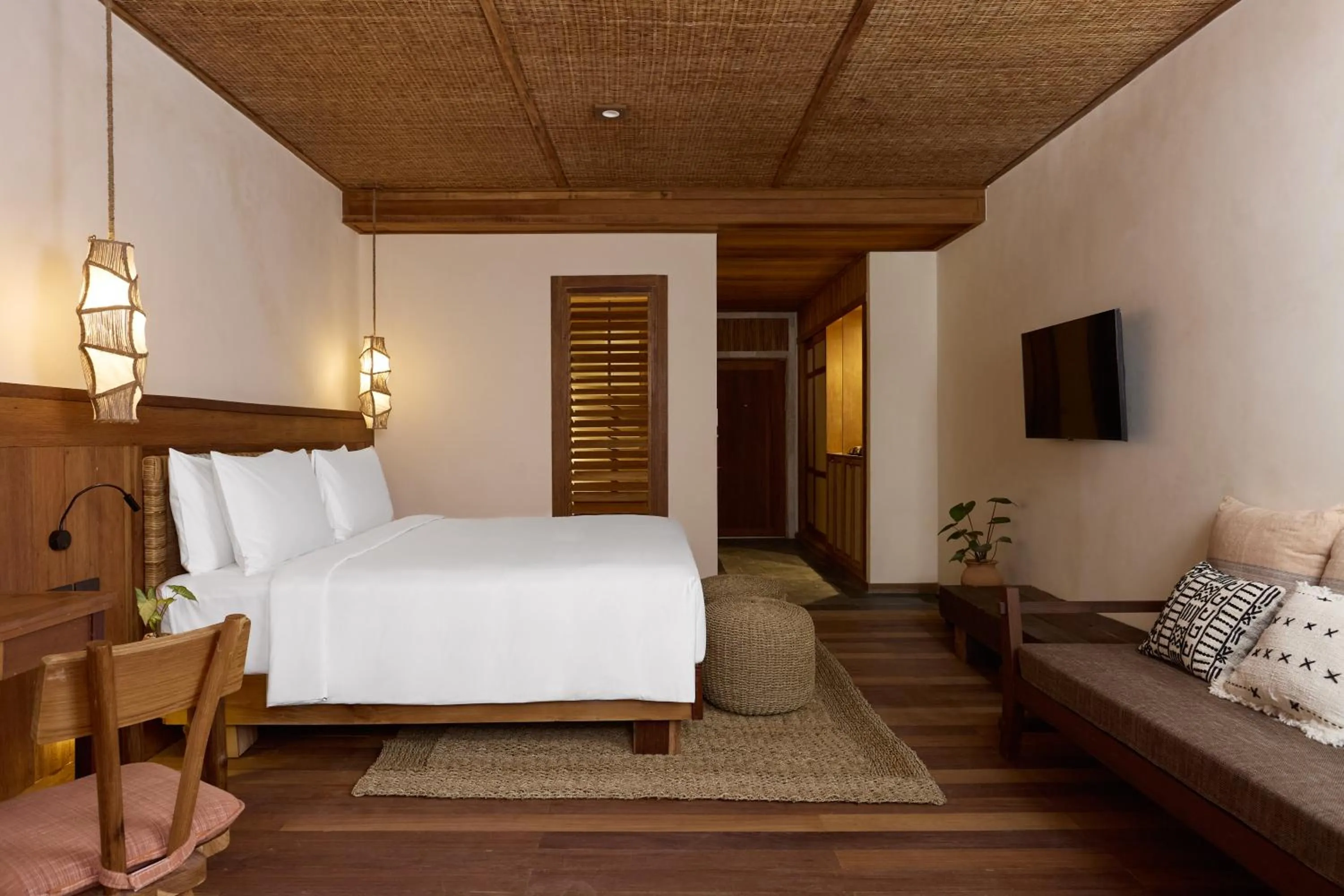Bed in Vignette Collection Dinso Resort & Villas Ko Chang by IHG