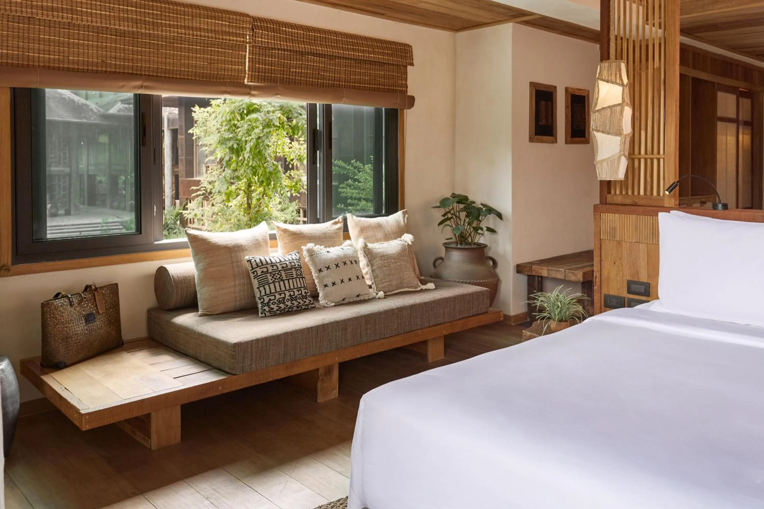 Bed in Vignette Collection Dinso Resort & Villas Ko Chang by IHG
