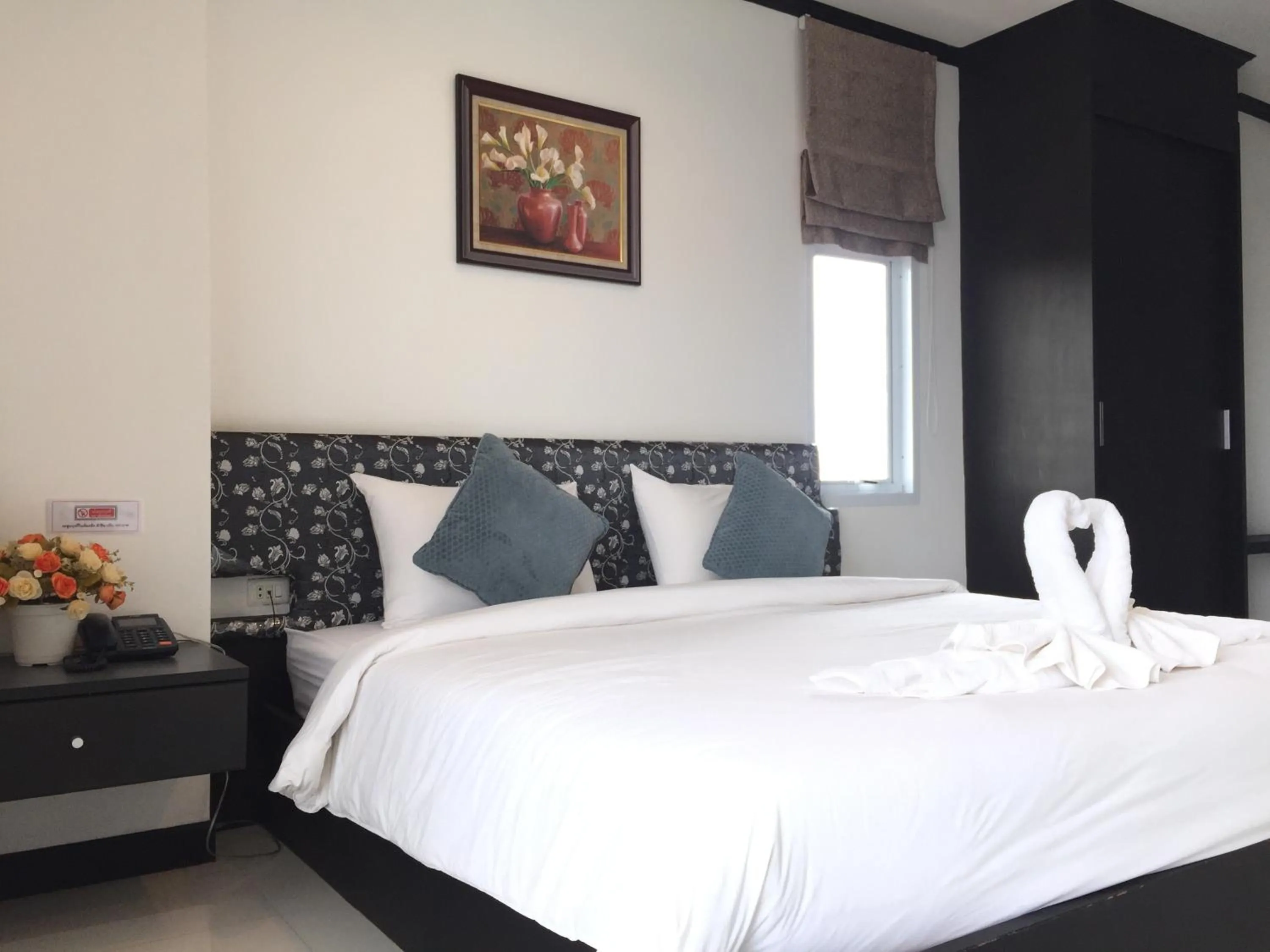 Bed in Leelawadee Grand Hotel