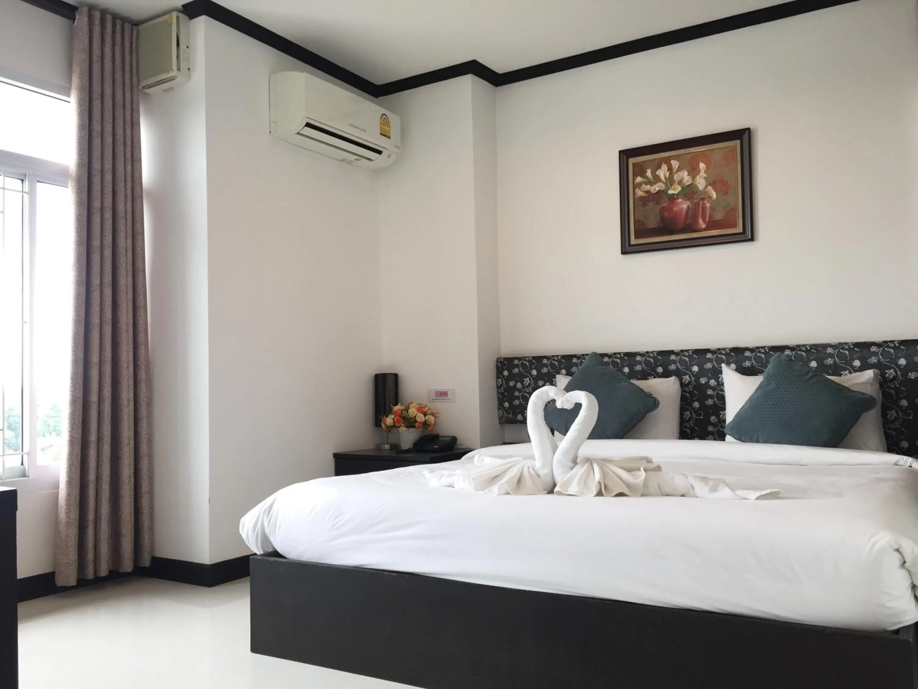 Bed in Leelawadee Grand Hotel